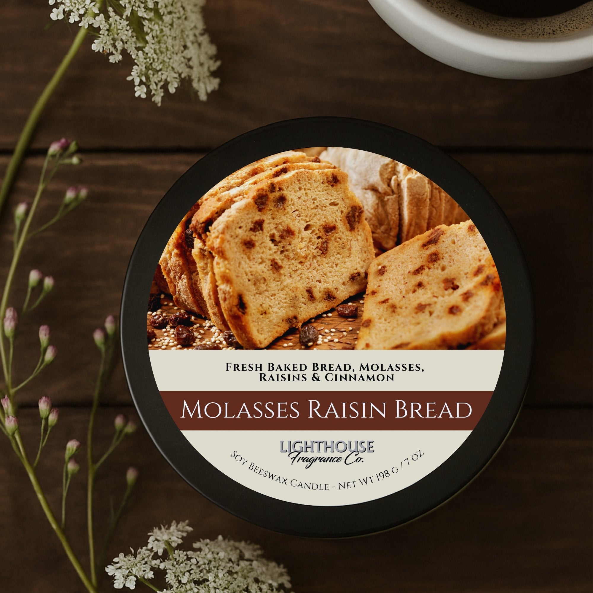 Molasses raisin bread candle with a wooden background and flowers