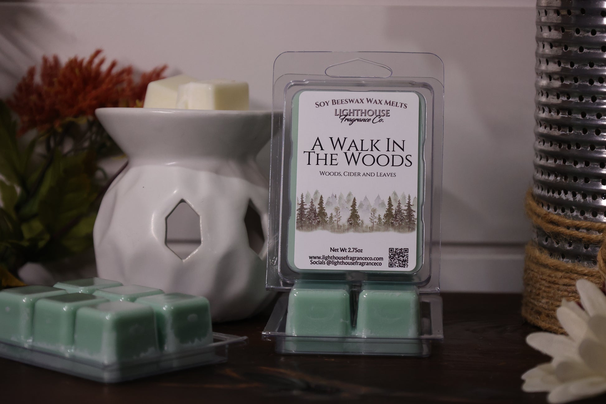 Scented wax melts packaging  with wax cubes on a wooden surface.