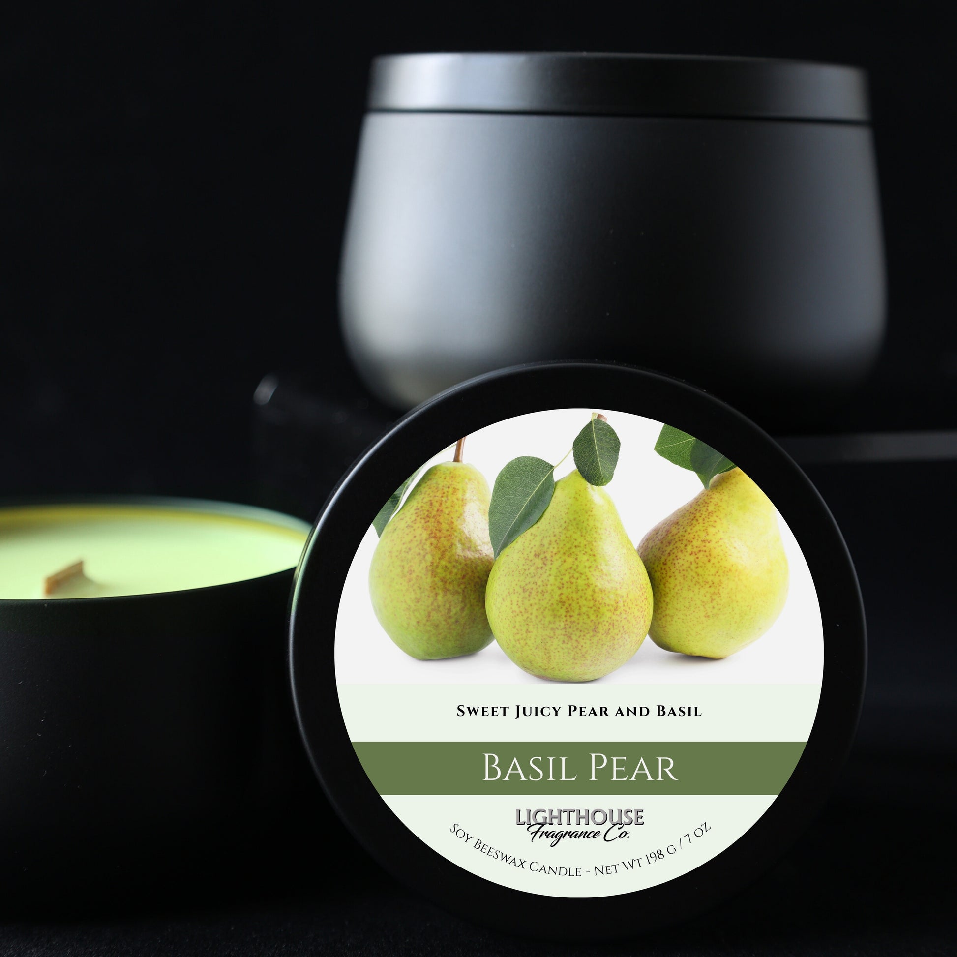 Basil Pear candle with a close-up of the label featuring pears on a black background