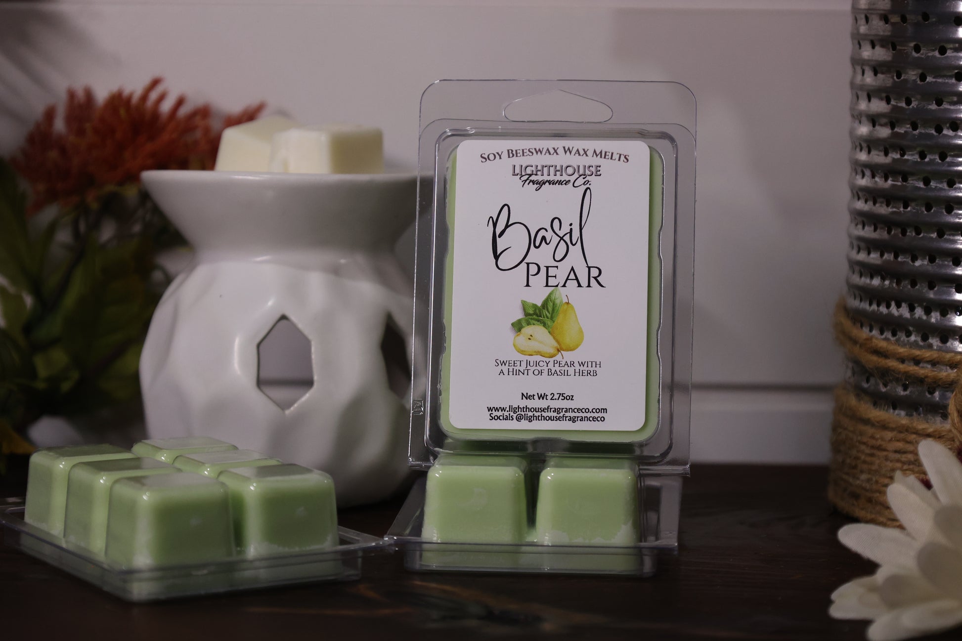 Basil Pear wax melts packaging with a white wax warmer on a wooden surface.