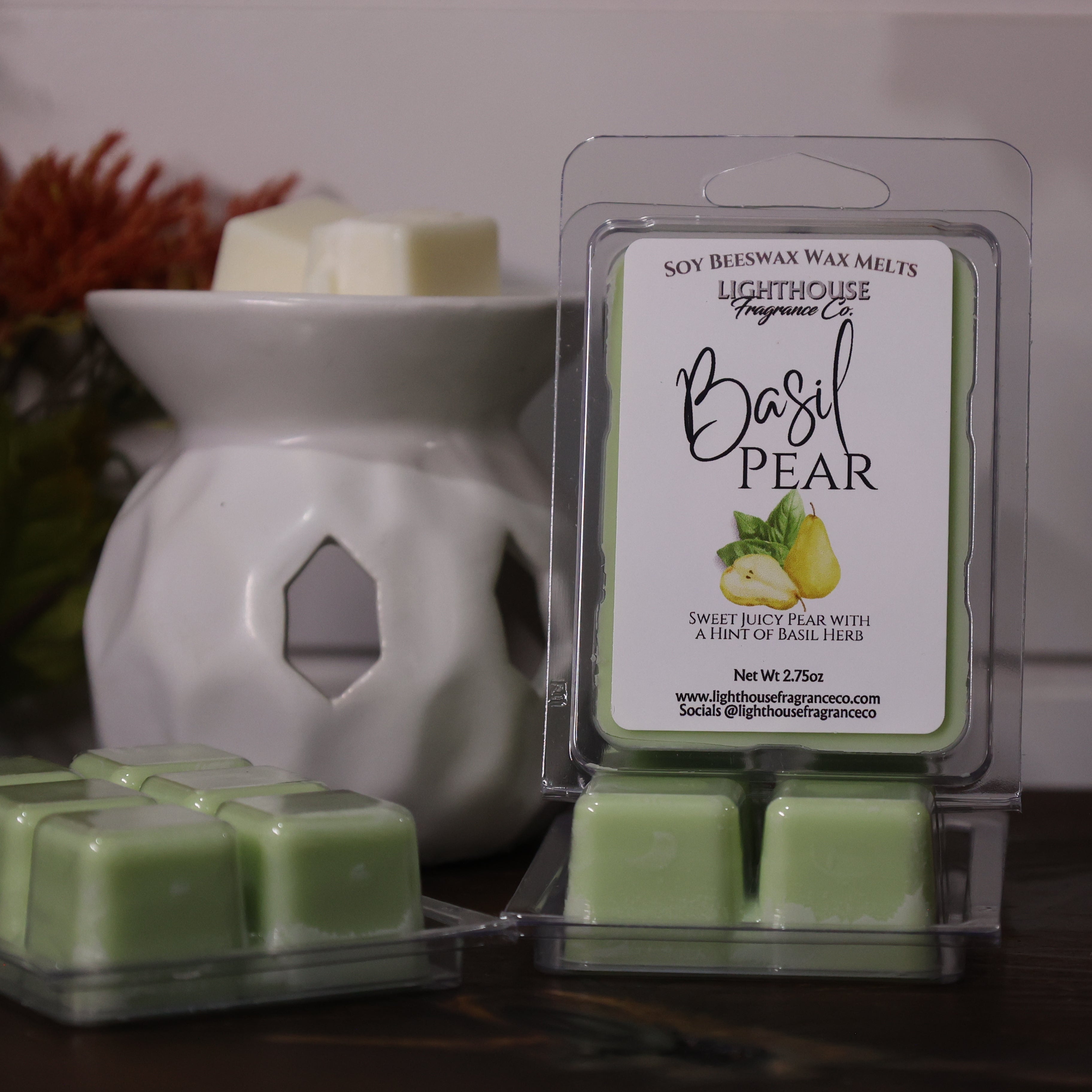 Basil Pear wax melts packaging with a white wax warmer on a wooden surface.