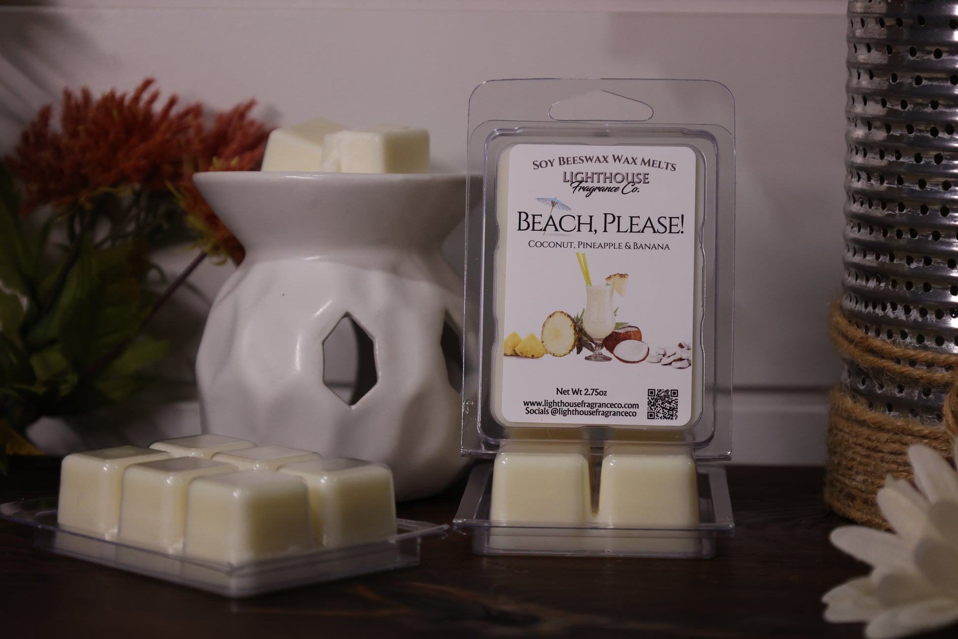 Beach-themed wax melts packaging with a wax warmer on a decorative surface.