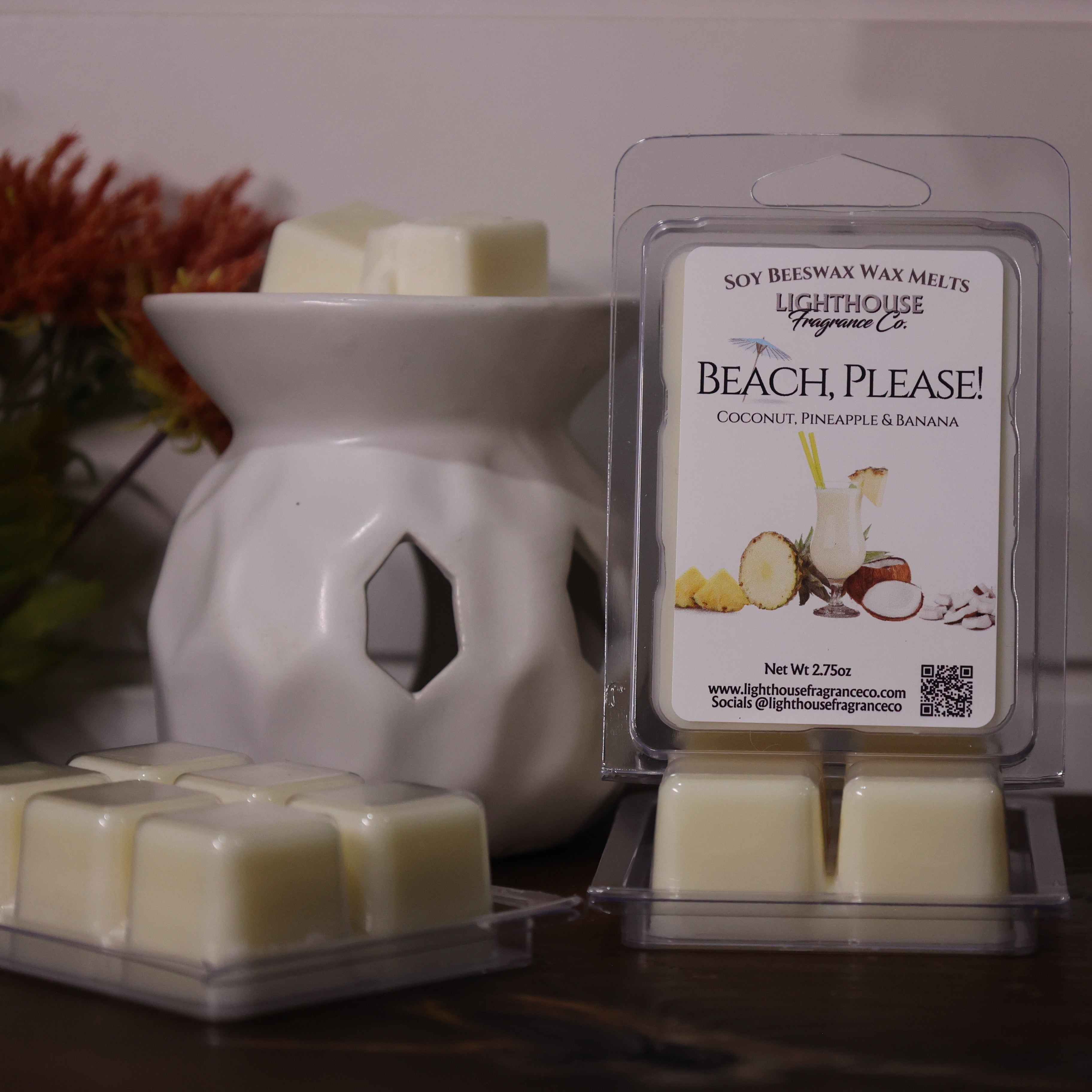 Beach-themed wax melts packaging with a wax warmer on a decorative surface.