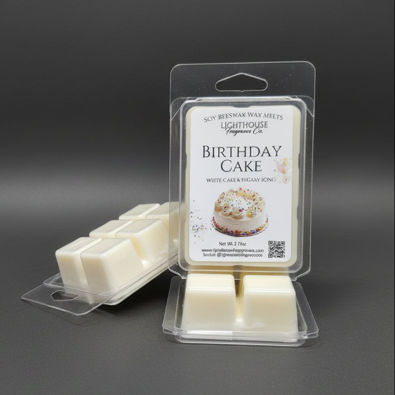 Birthday cake scented wax melts in packaging on a gray surface