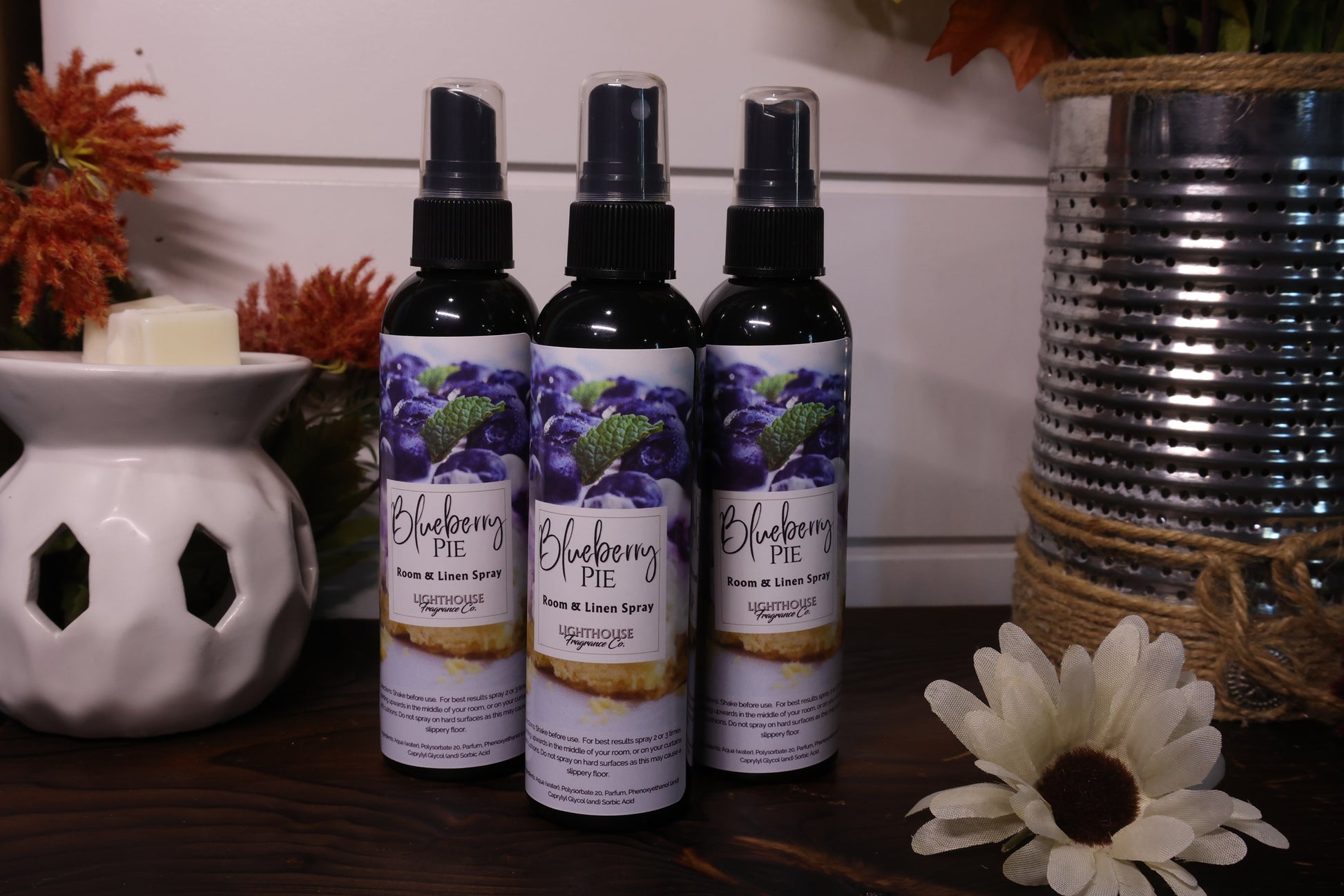 room spray bottles on wooden table