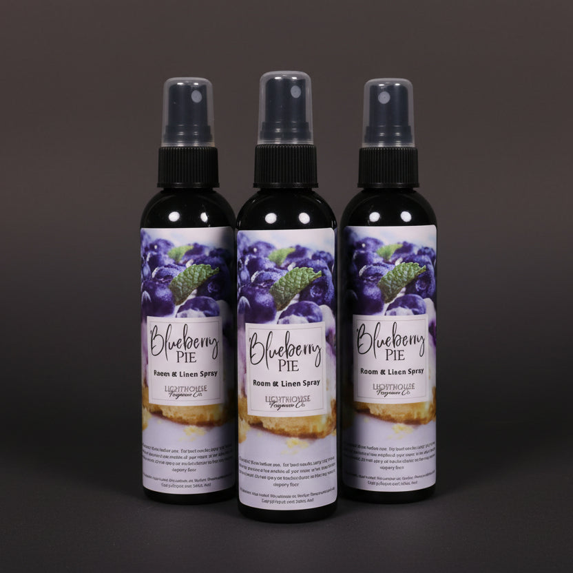 room spray bottles on wooden table