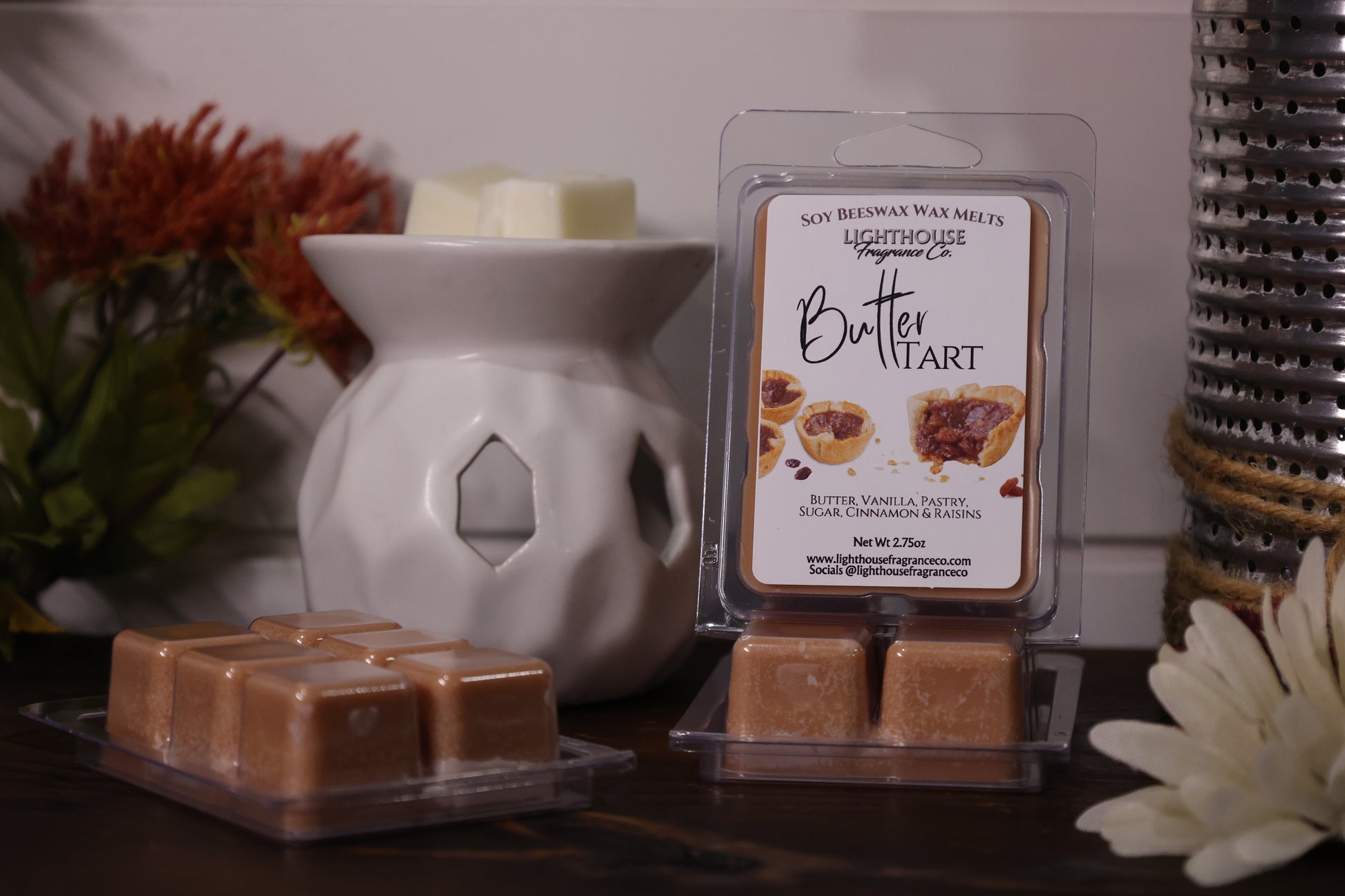 Butter tart wax melts in packaging with a white wax warmer on a wooden surface.