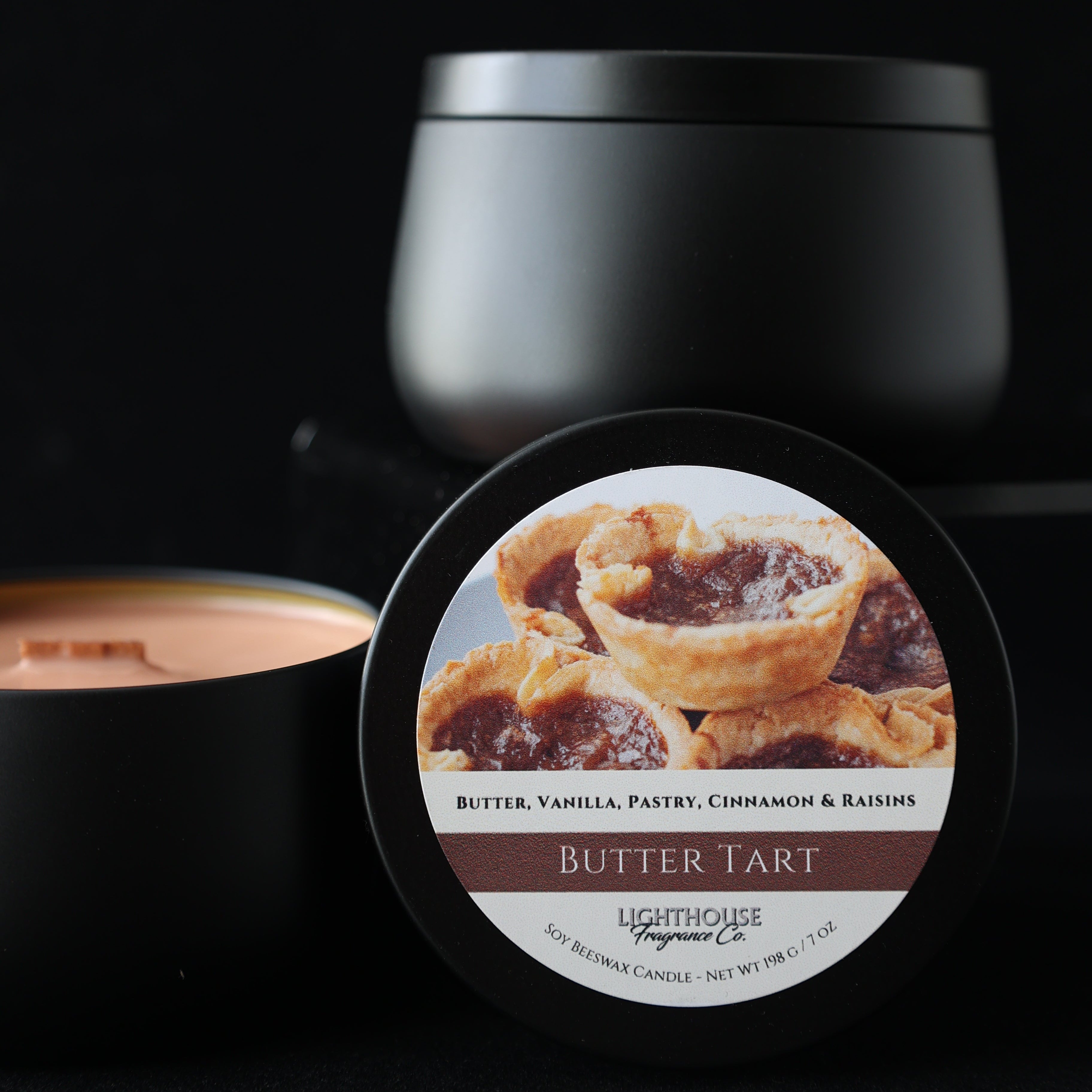 Butter tart jar candle with a label on a black background