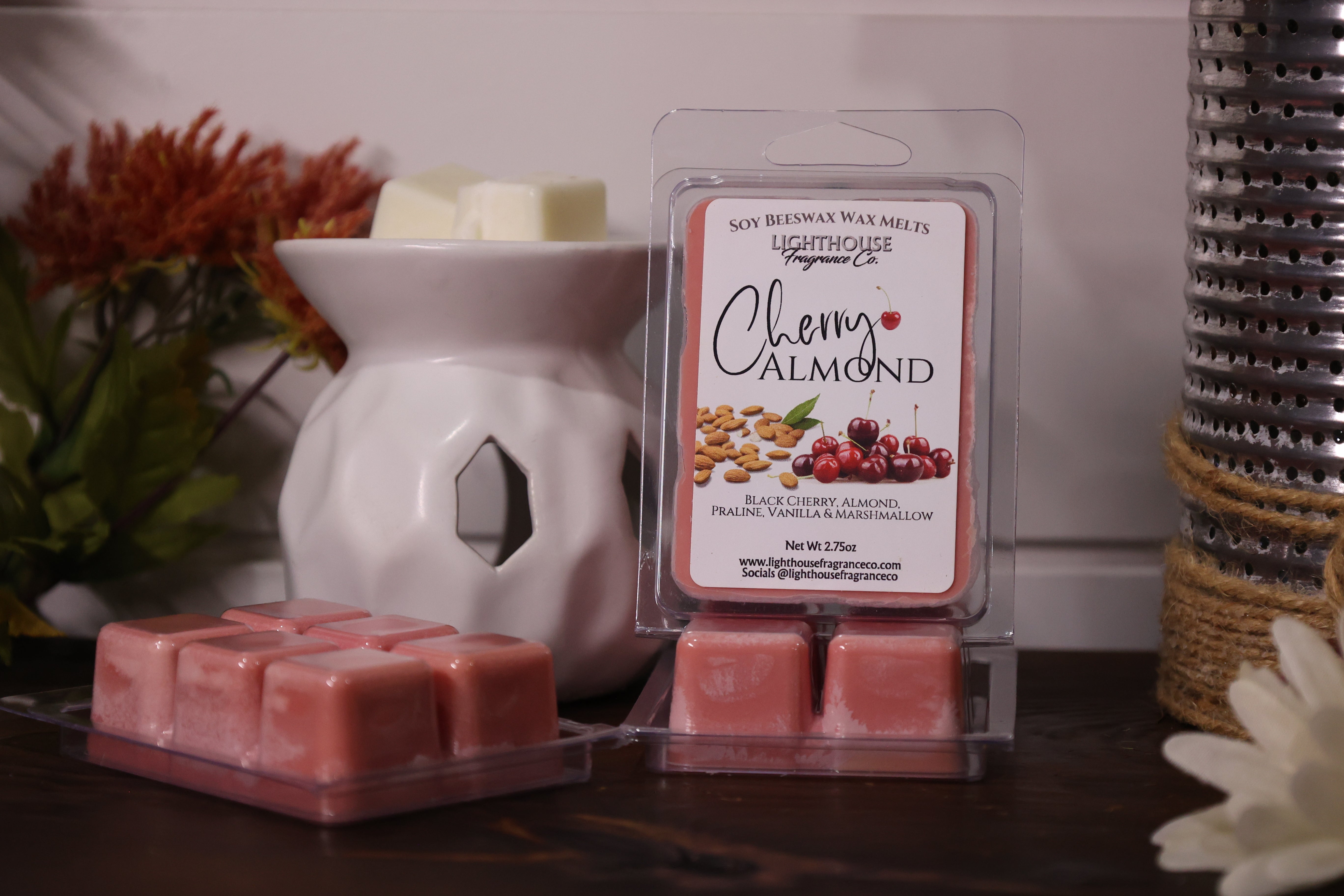 Cherry Almond wax melts packaging with a white wax warmer on a wooden surface.