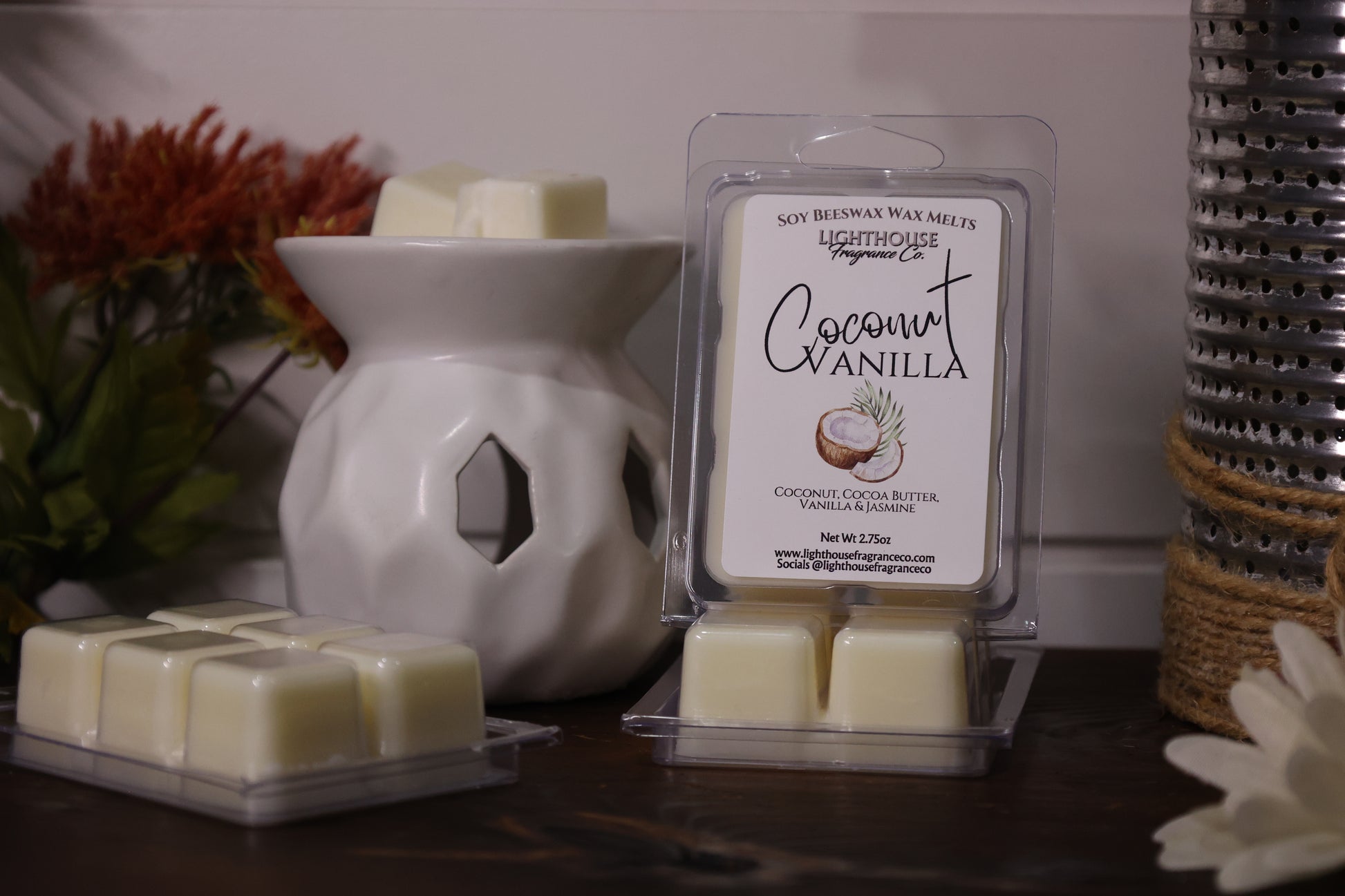 Coconut Vanilla wax melts in packaging with a white wax warmer on a wooden surface.