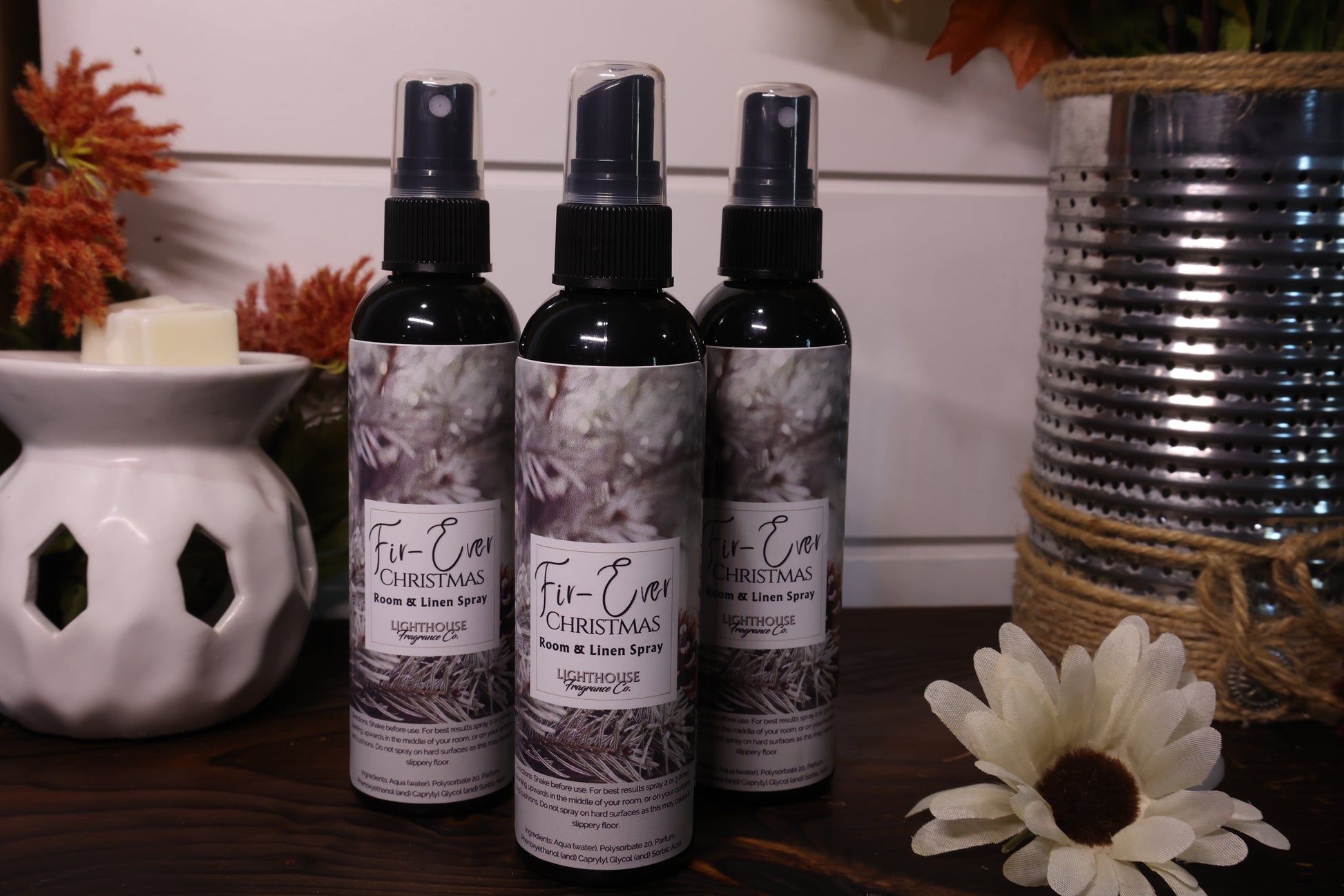 room spray bottles on wooden table