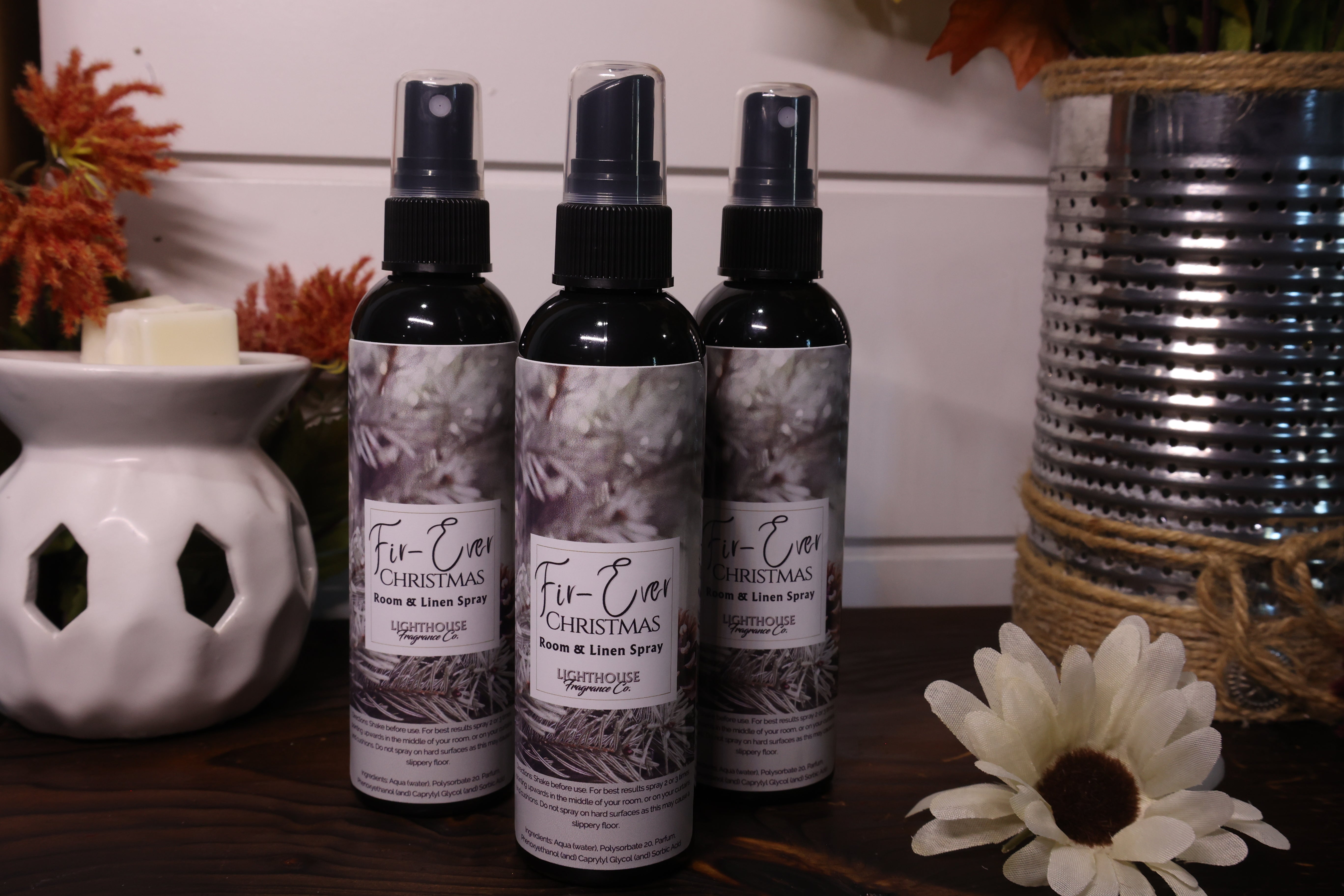 room spray bottles on wooden table