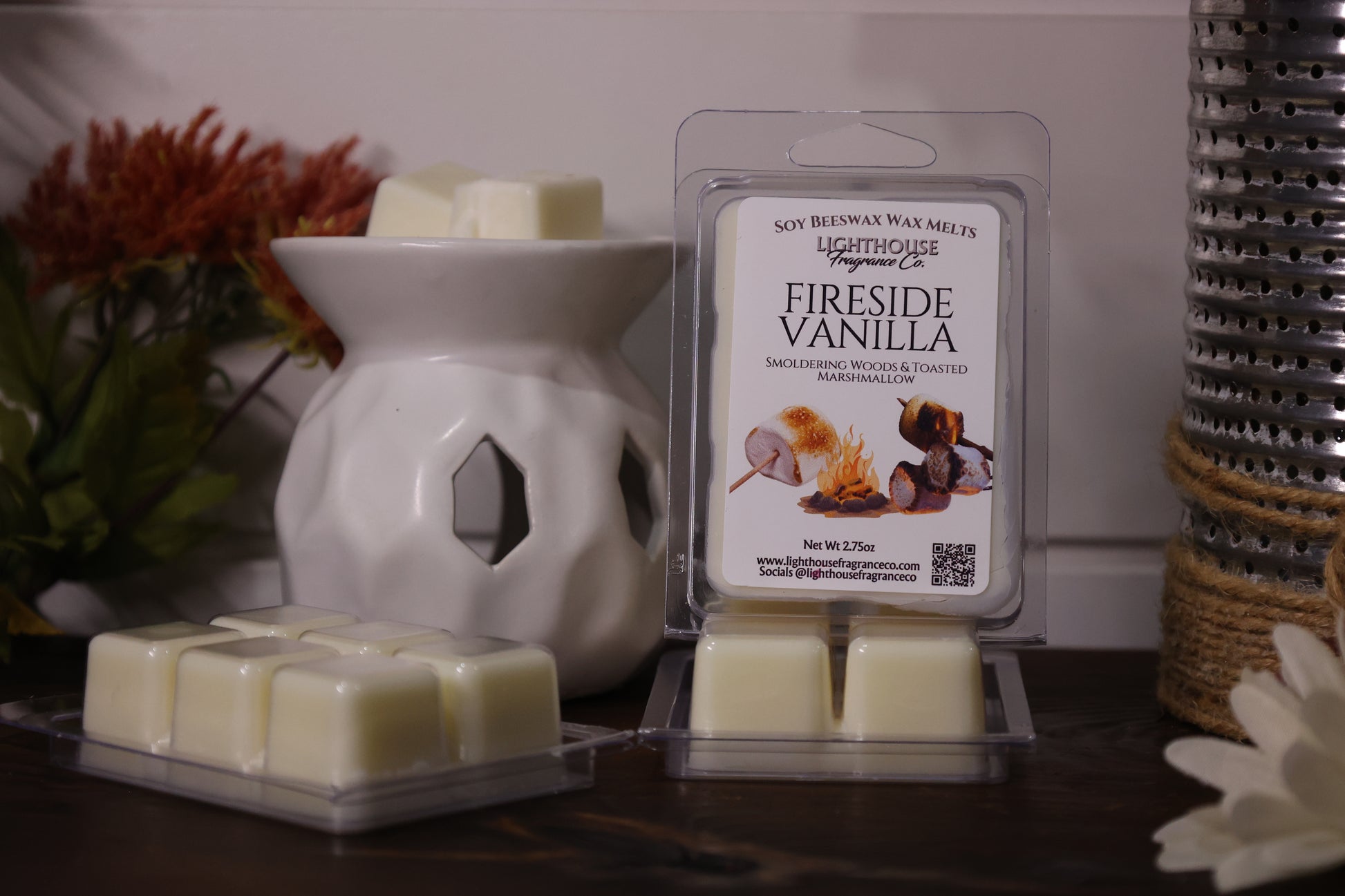 Fireside Vanilla wax melts in packaging with a white wax warmer on a wooden surface.