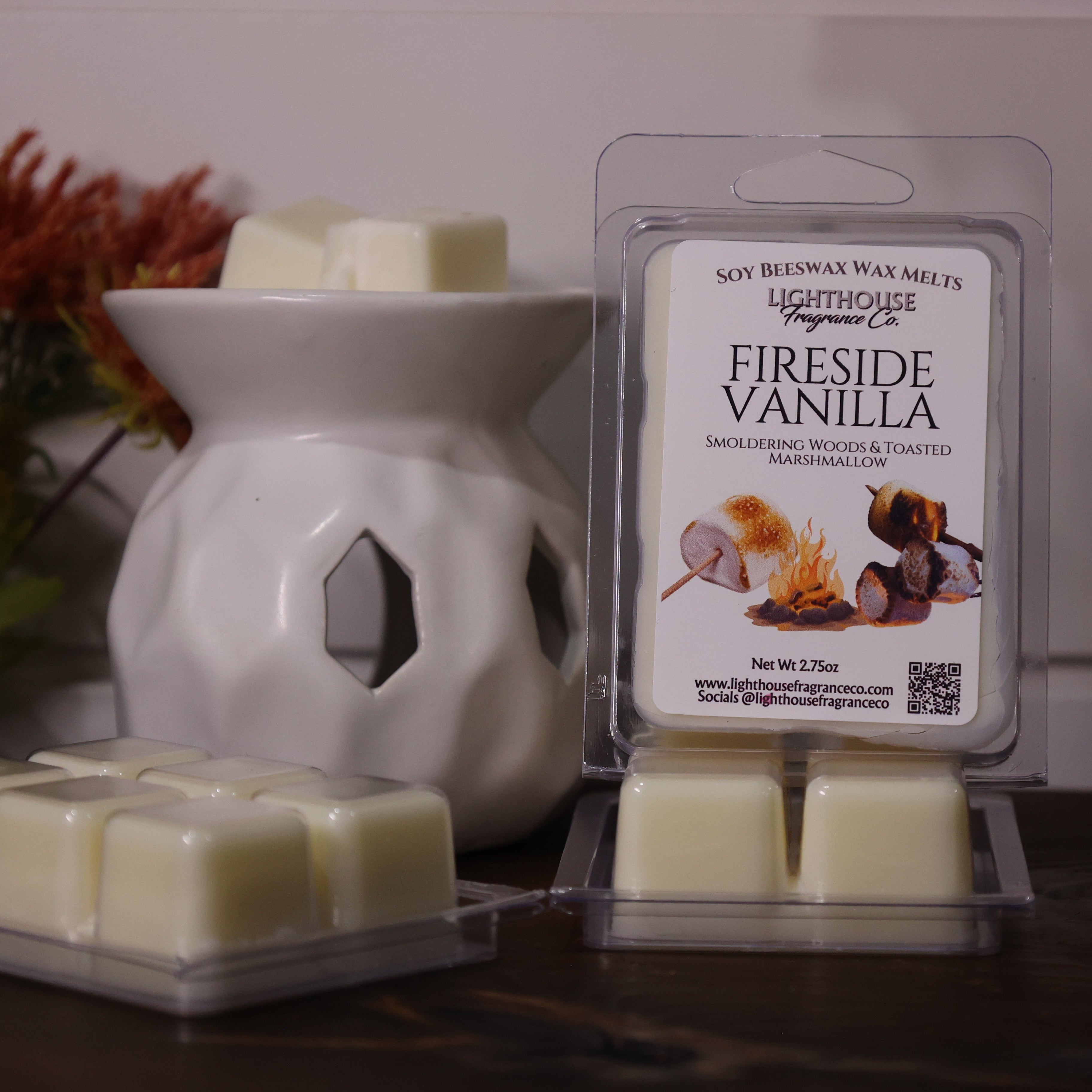 Fireside Vanilla wax melts in packaging with a white wax warmer on a wooden surface.