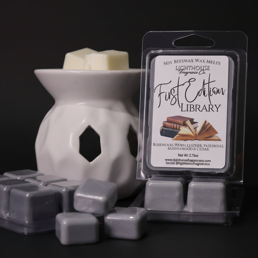 Packaged wax melts with a diffuser on a wooden surface