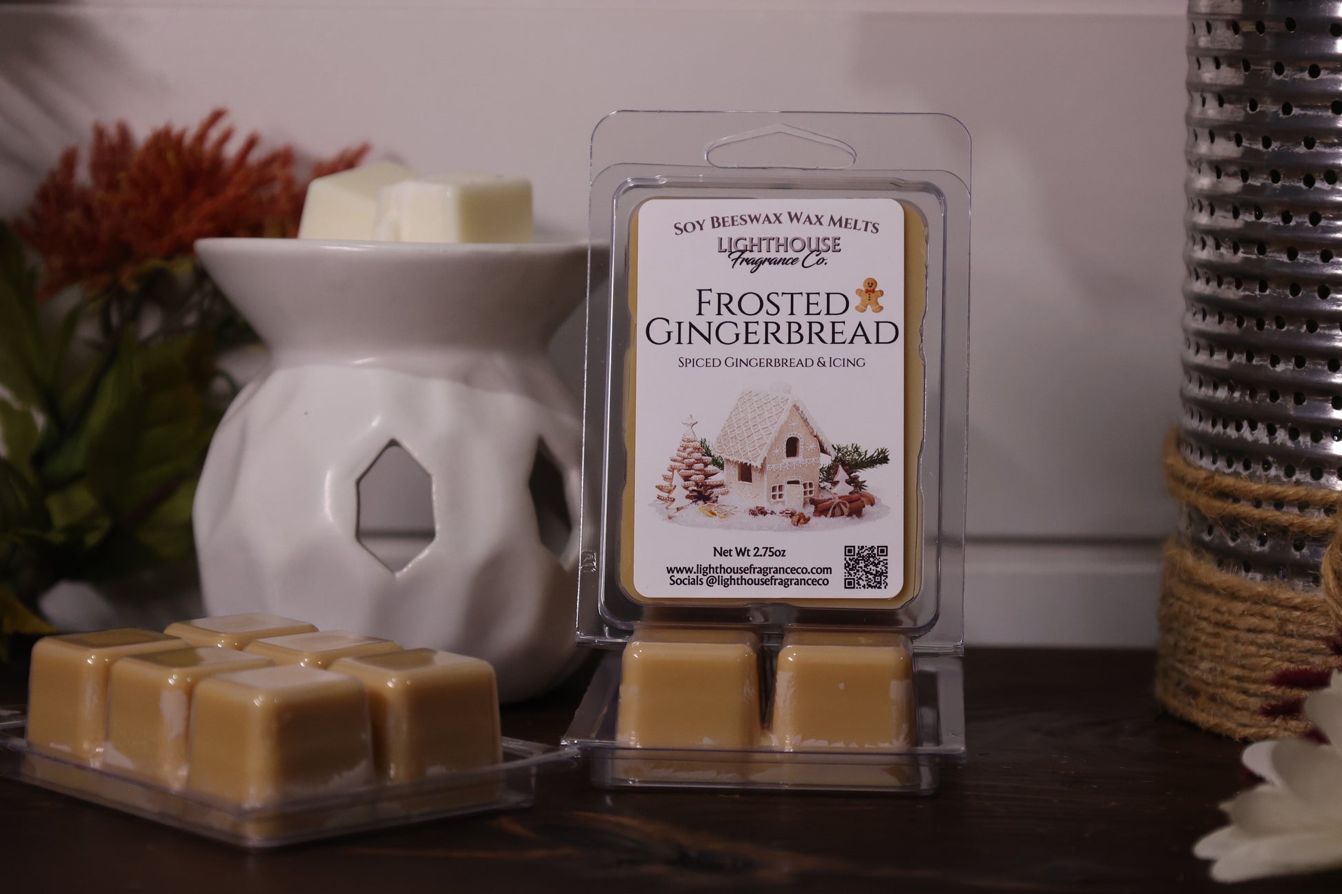 Frosted Gingerbread wax melts packaging with a white wax warmer on a wooden surface.