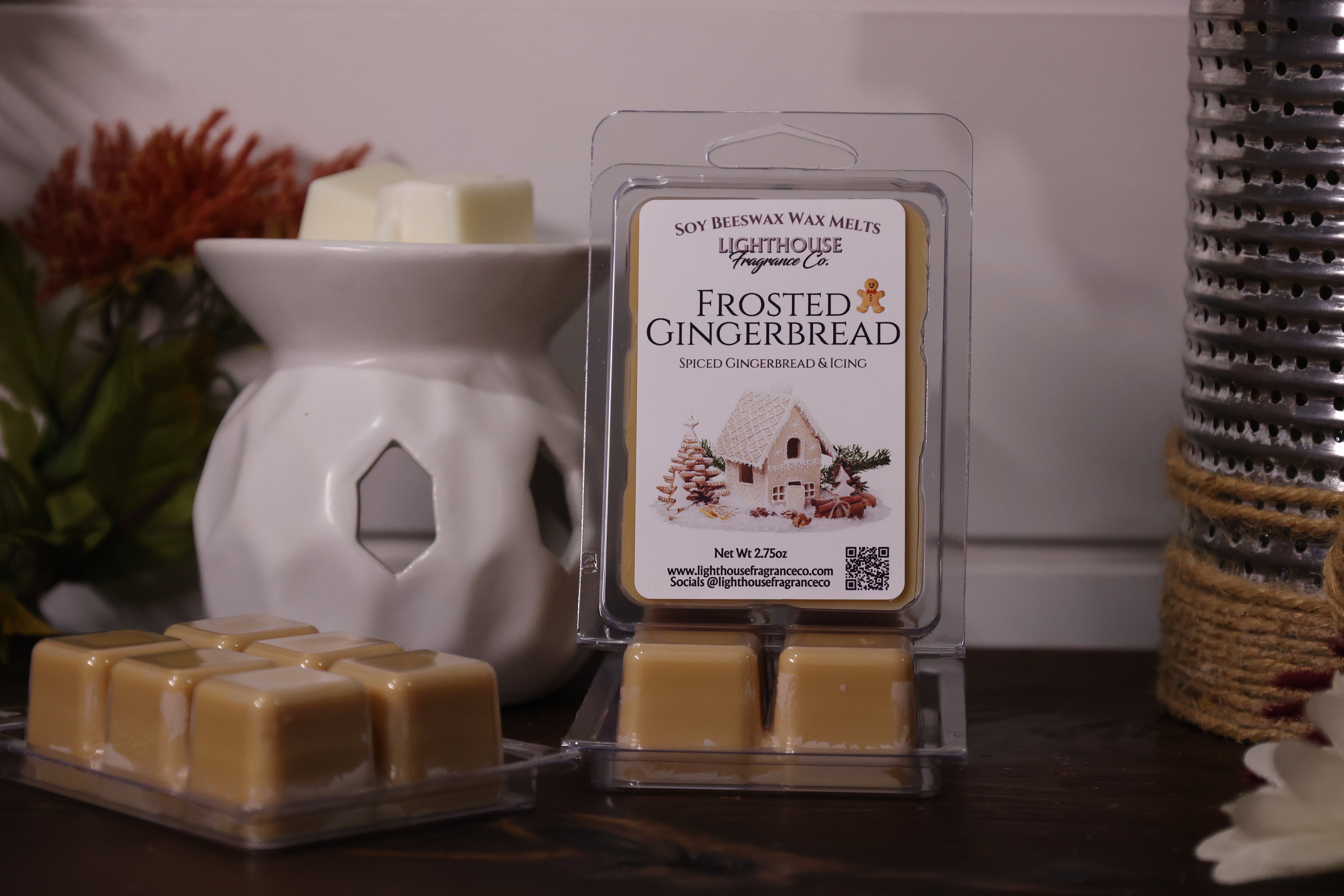 Frosted Gingerbread wax melts packaging with a white wax warmer on a wooden surface.