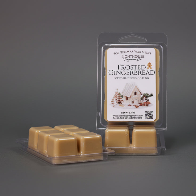 Frosted Gingerbread wax melts packaging with a white wax warmer on a wooden surface.