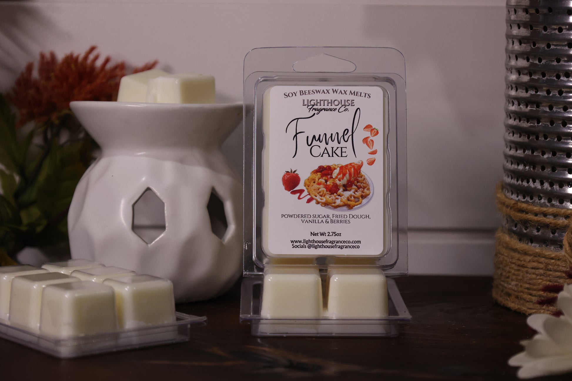 Packaged Funnel Cake scented wax melts with a wax warmer on a wooden surface.