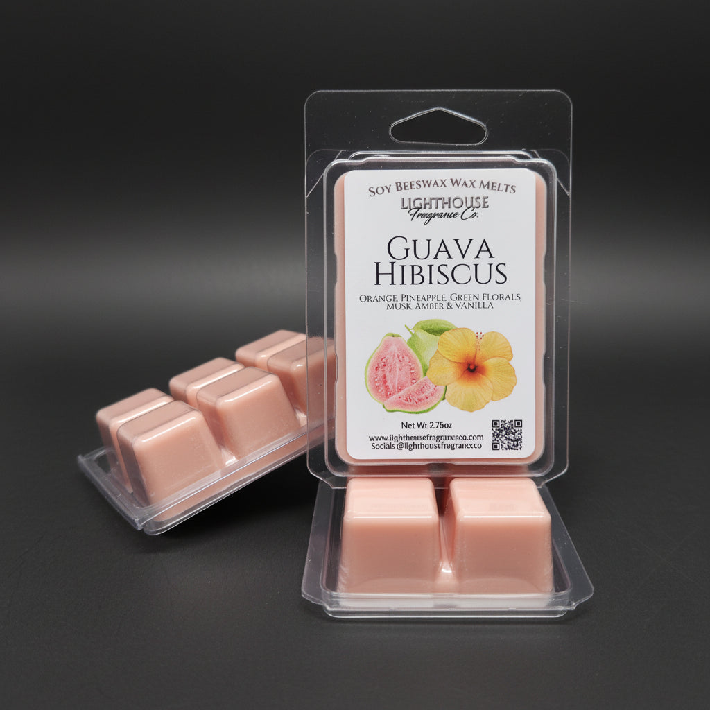 Pink wax melts in a clear packaging with a label on a gray surface