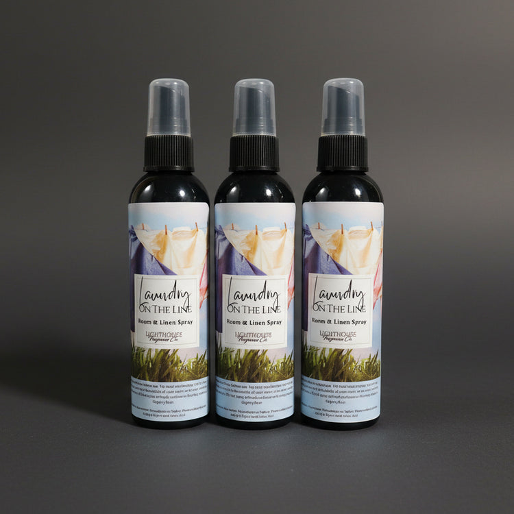 bottle of room spray with a dark grey background