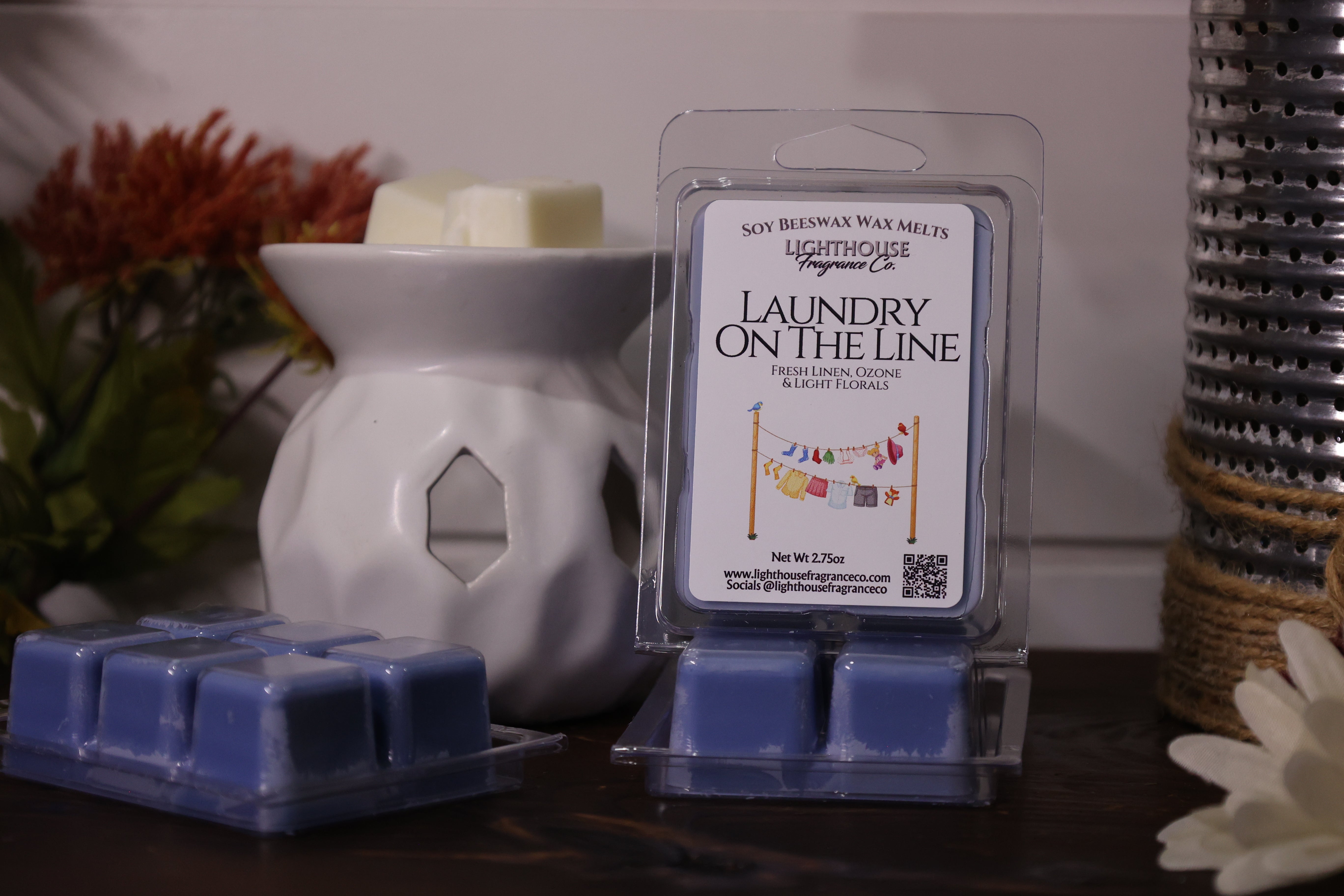 Packaged soy wax melts with a wax melter on a wooden surface