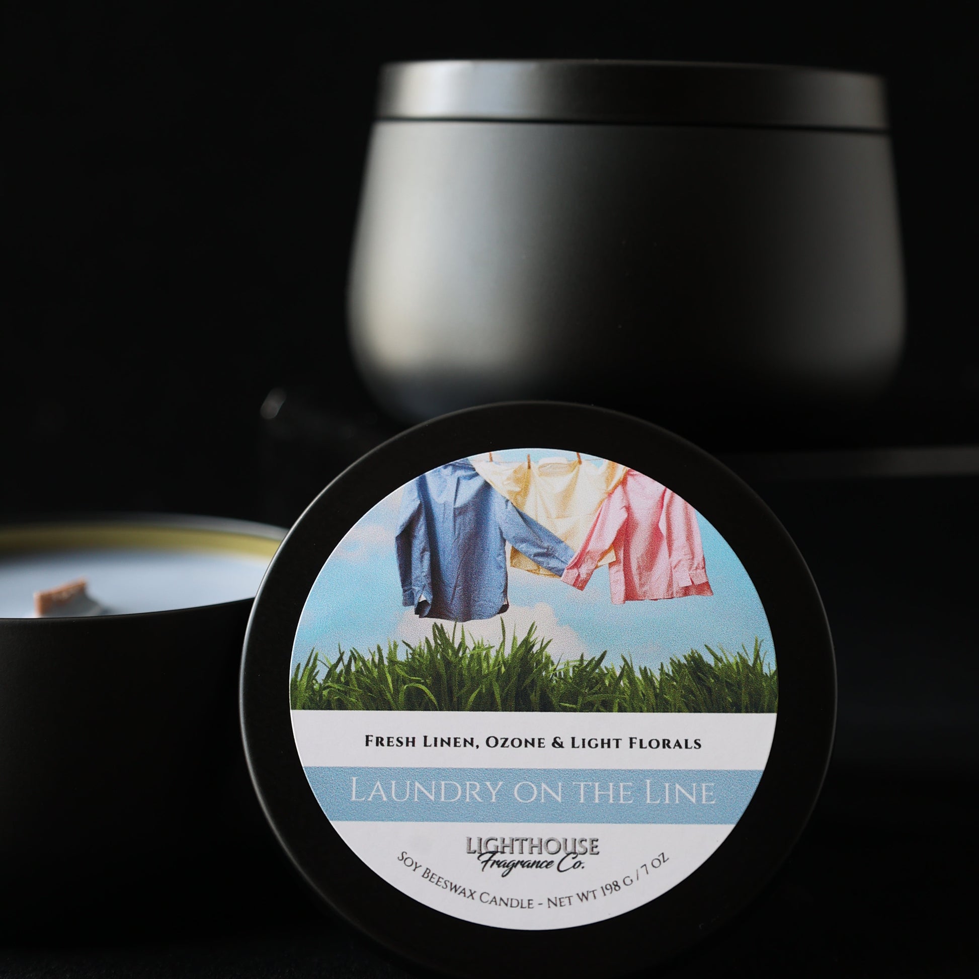 Laundry on the line candle in a black tin