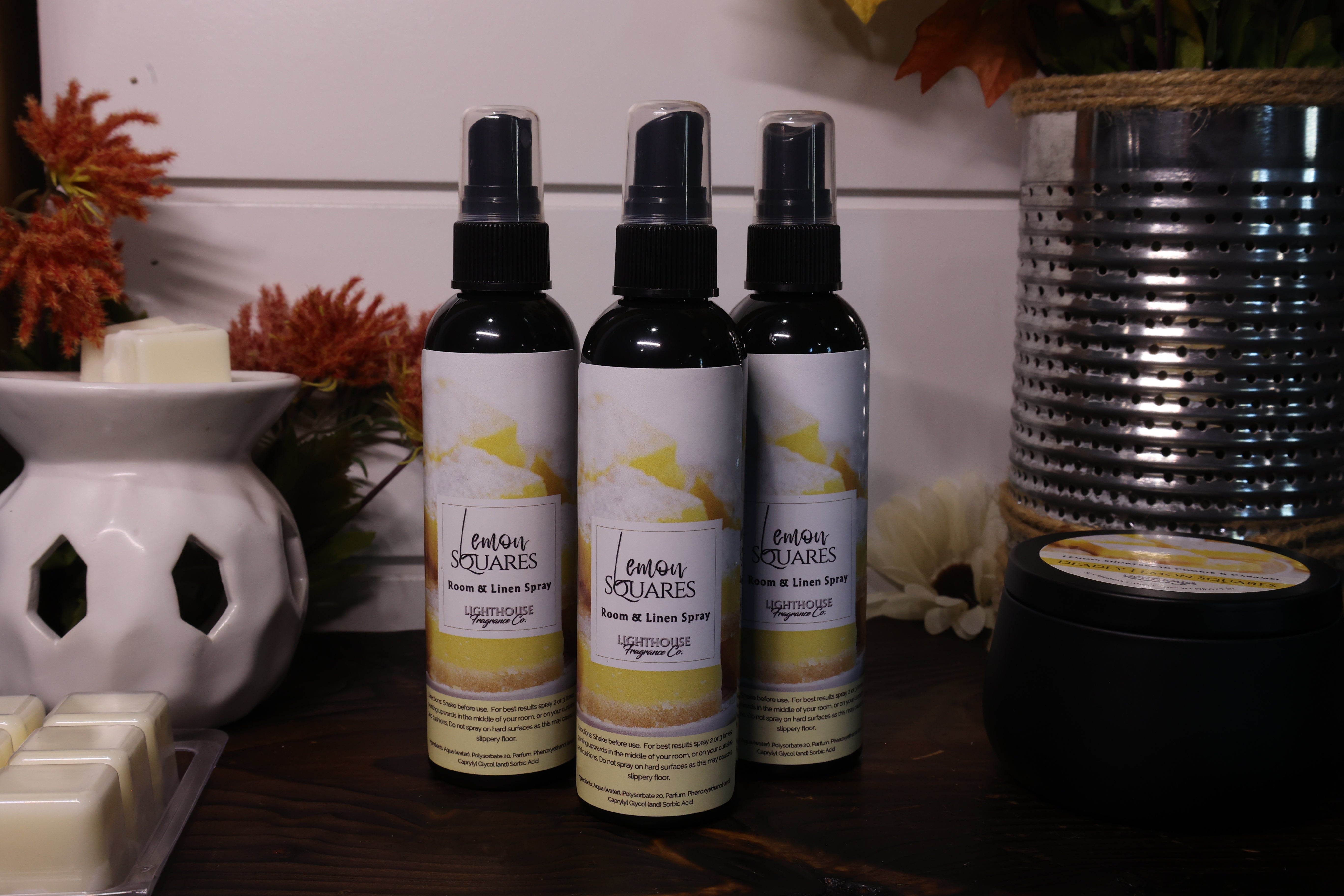 room spray bottles on wooden table