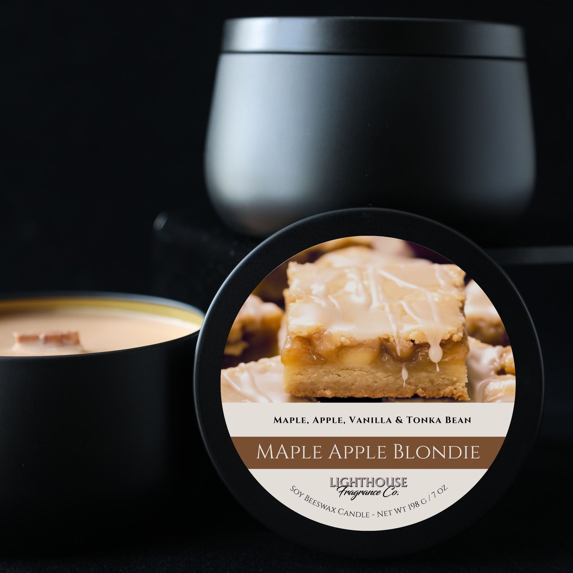 Black candle with a label featuring a blondie bar and the name 'Maple Apple Blondie' on a dark background.