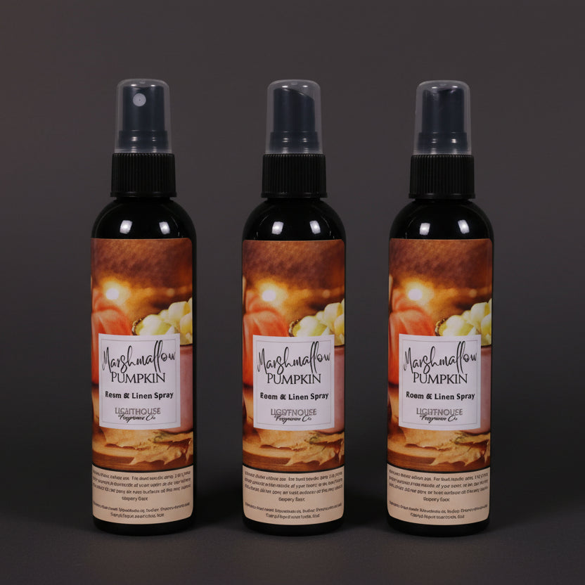 room spray bottles on wooden table