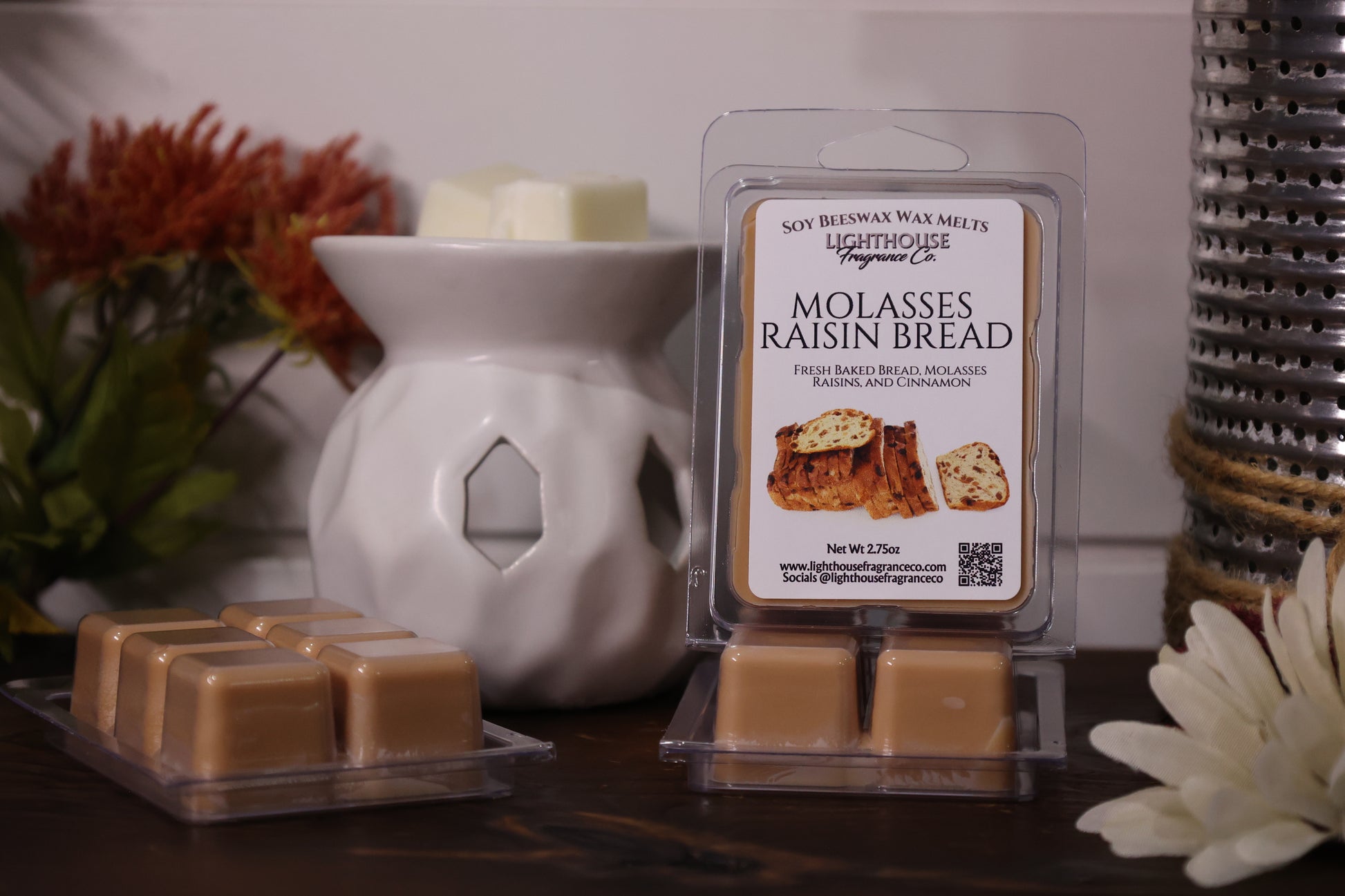 Molasses Raisin Bread wax melts with packaging in front of a white wax warmer.