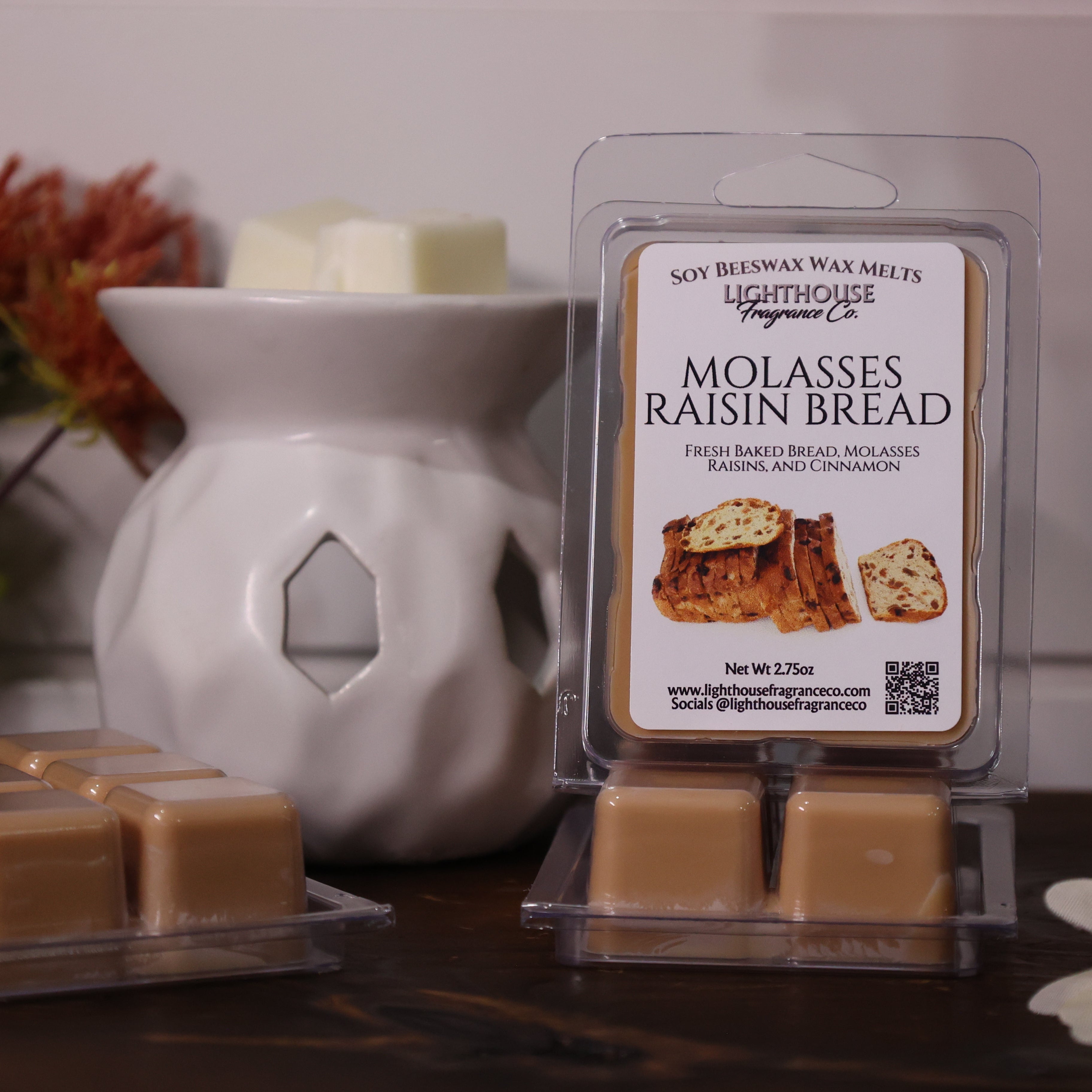 Molasses Raisin Bread wax melts with packaging in front of a white wax warmer.
