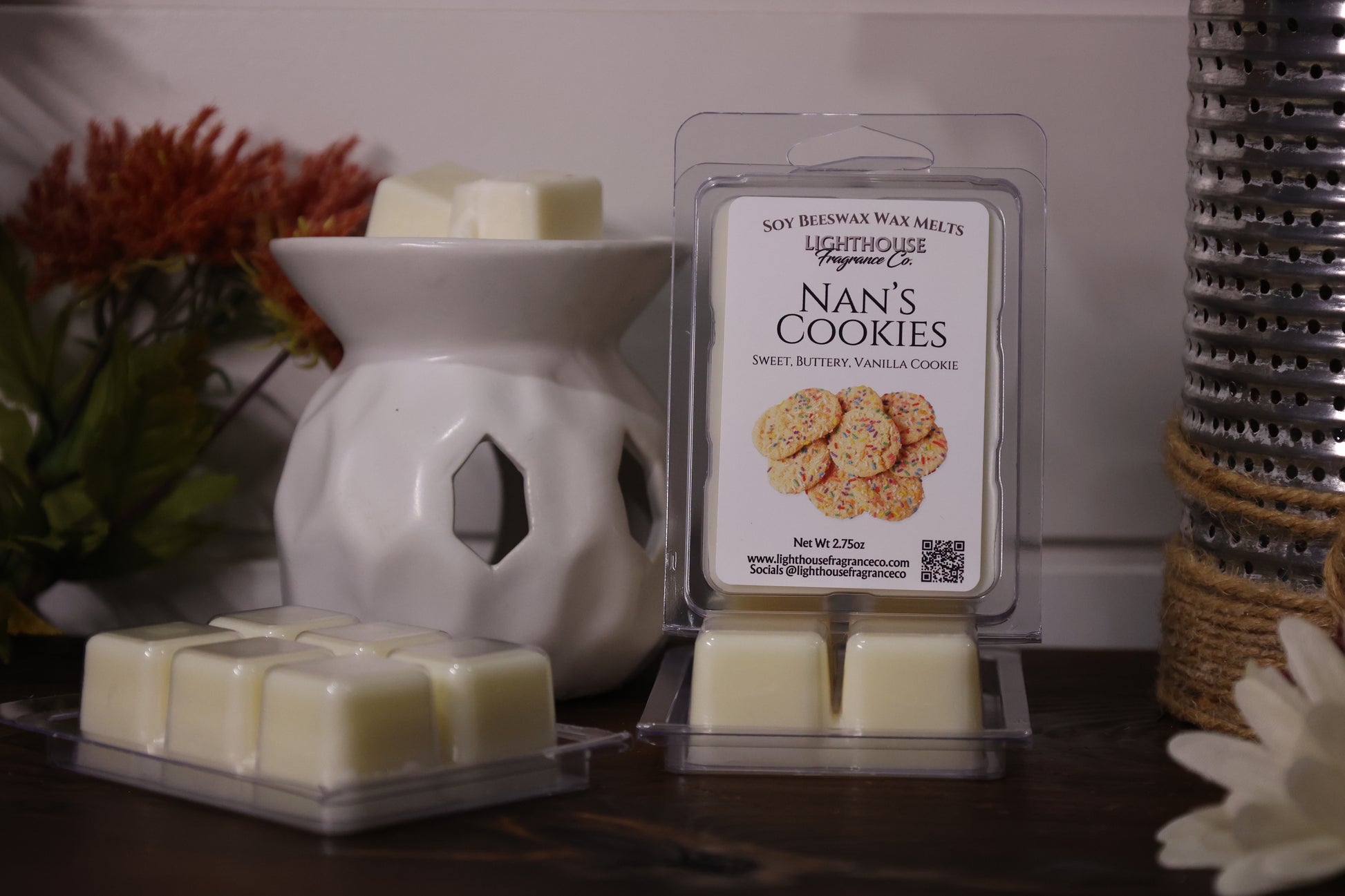 Nan's Cookies wax melts packaging with a white wax warmer on a wooden surface.