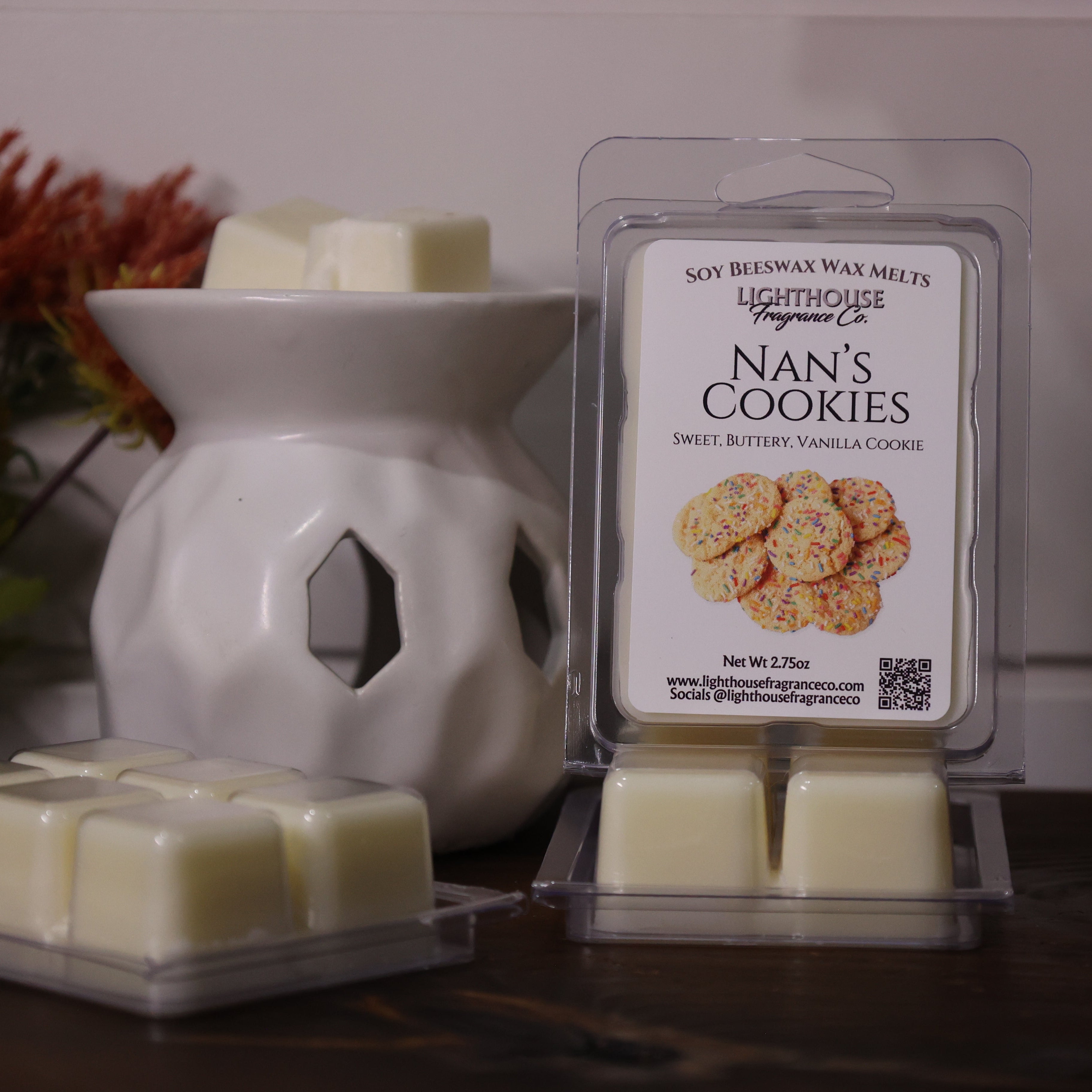 Nan's Cookies wax melts packaging with a white wax warmer on a wooden surface.