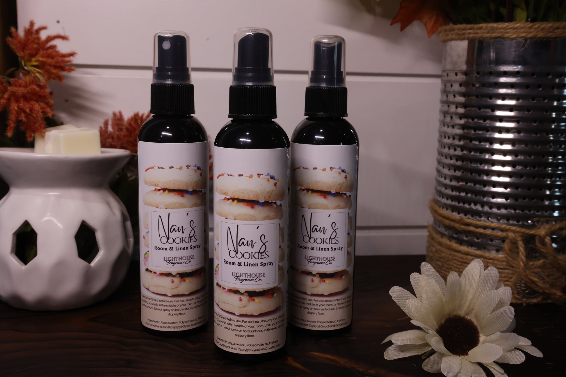 room spray bottles on wooden table