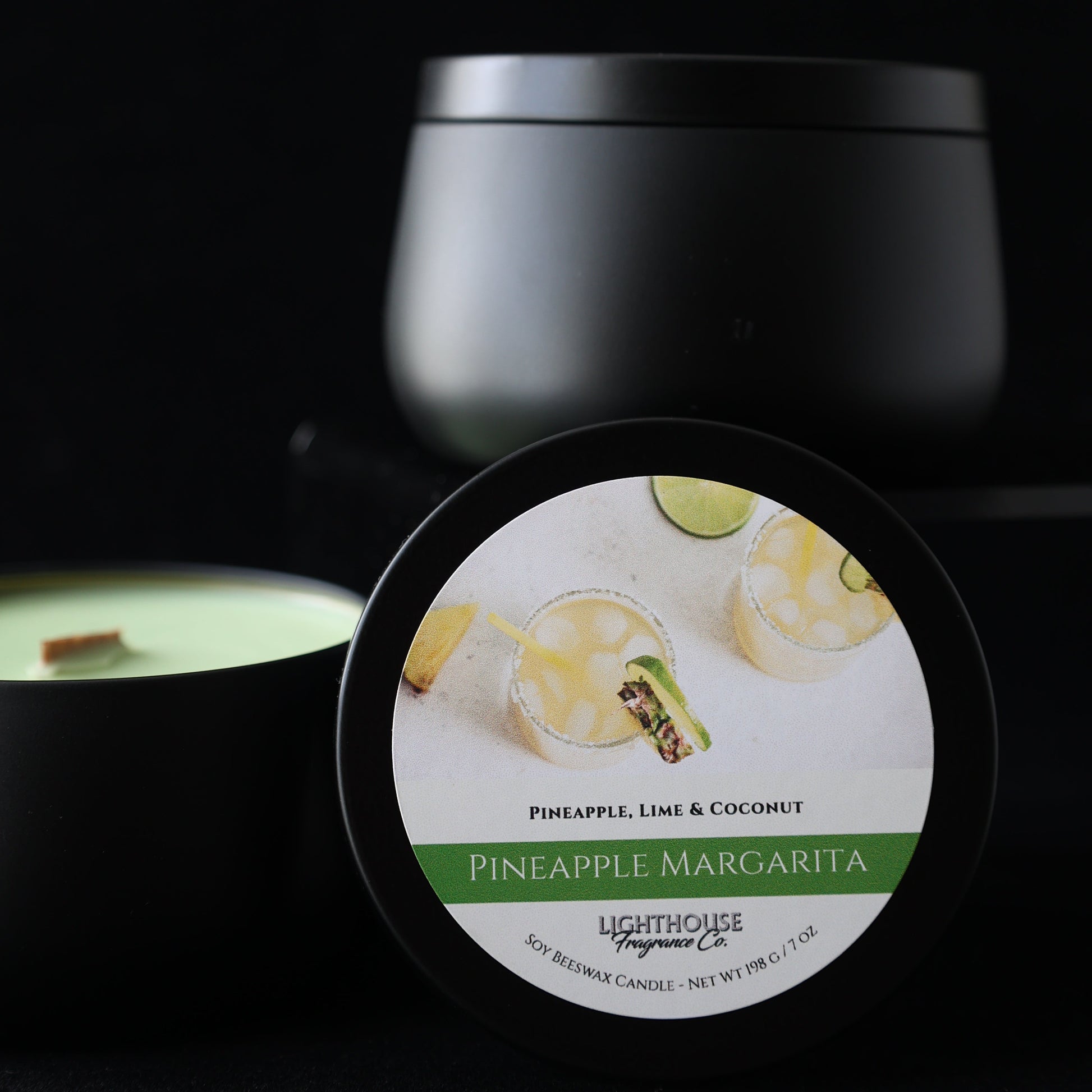 Pineapple Margarita Candle in a black tin against a black background