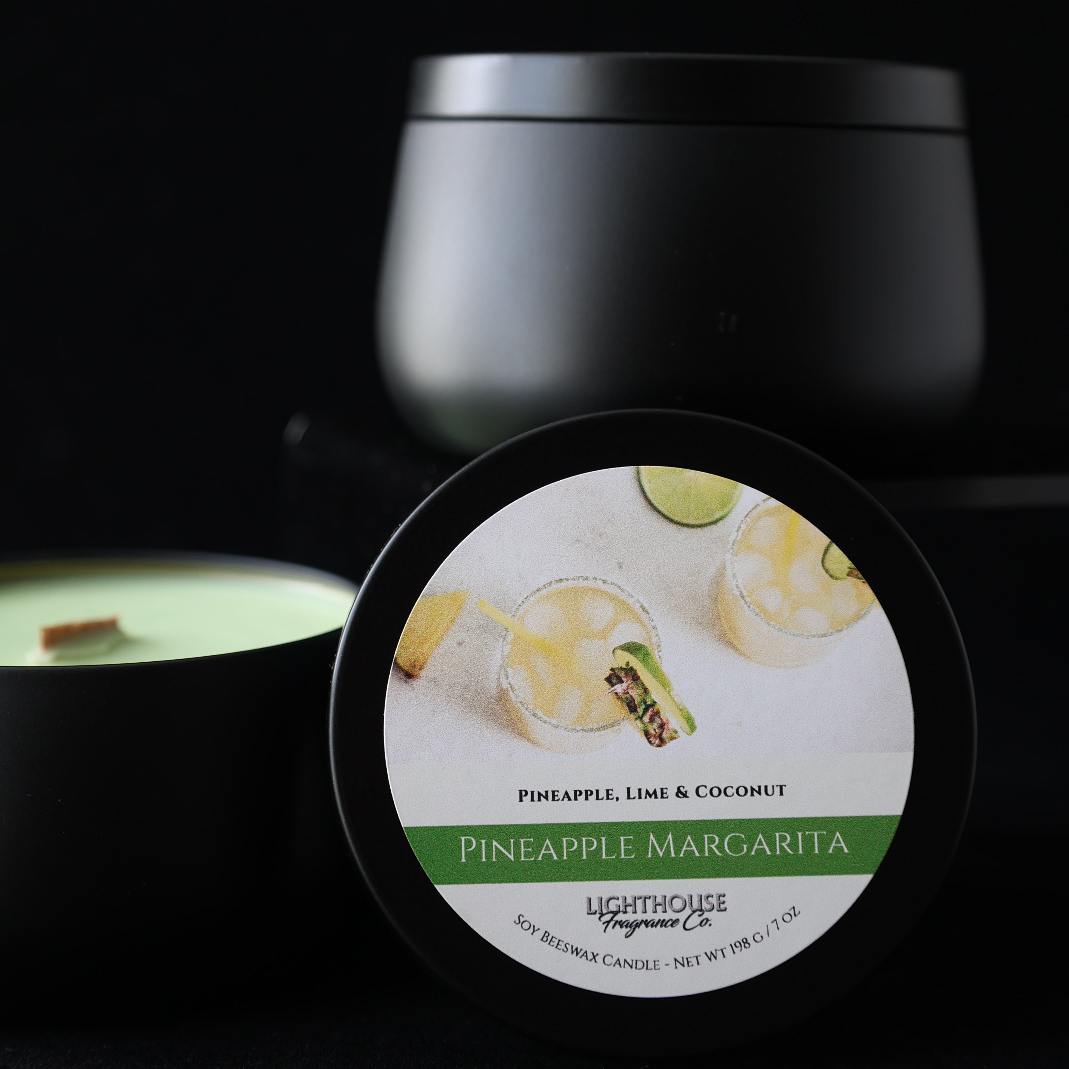 Pineapple Margarita Candle in a black tin against a black background