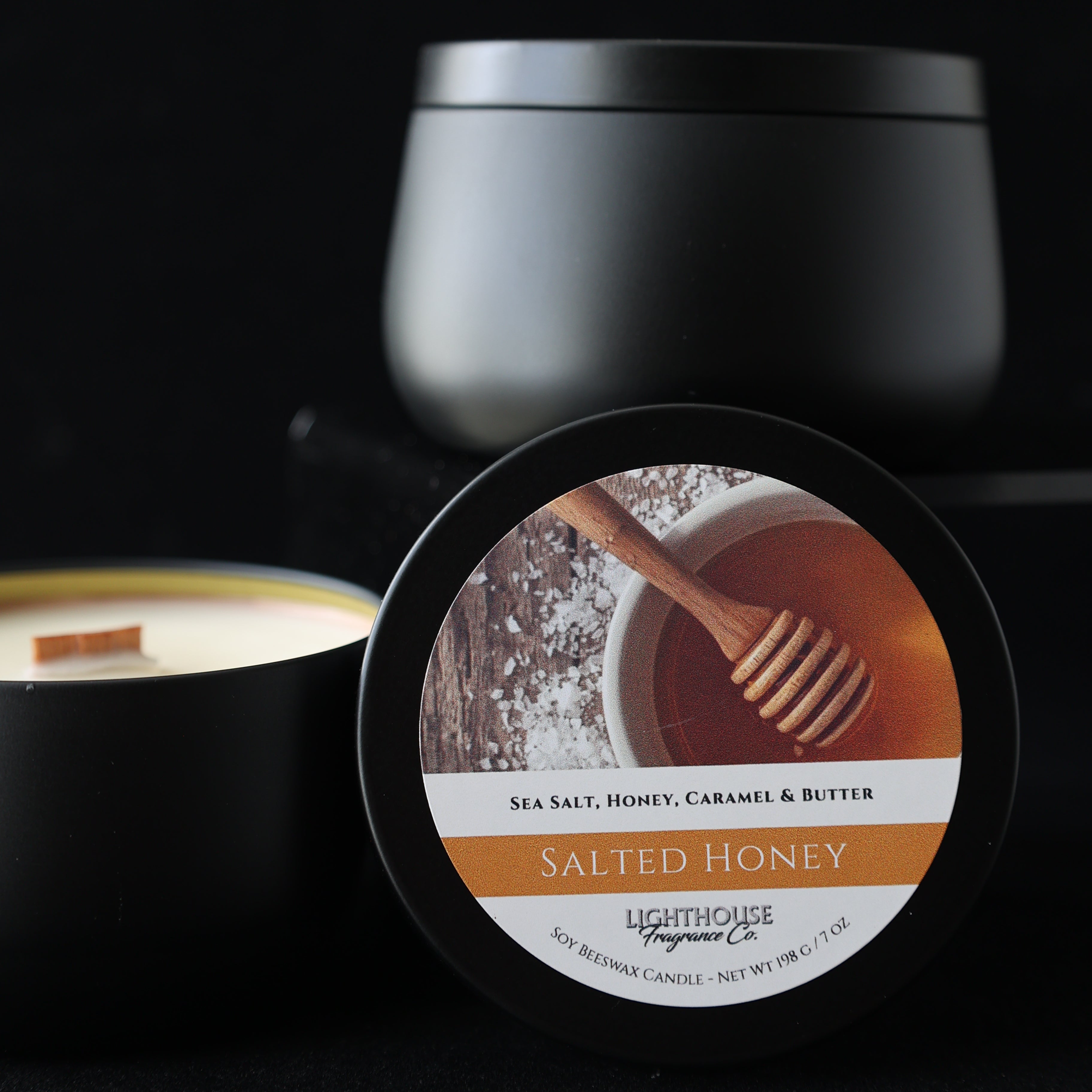 salted honey candle with a label featuring a wooden spoon and honeycomb.
