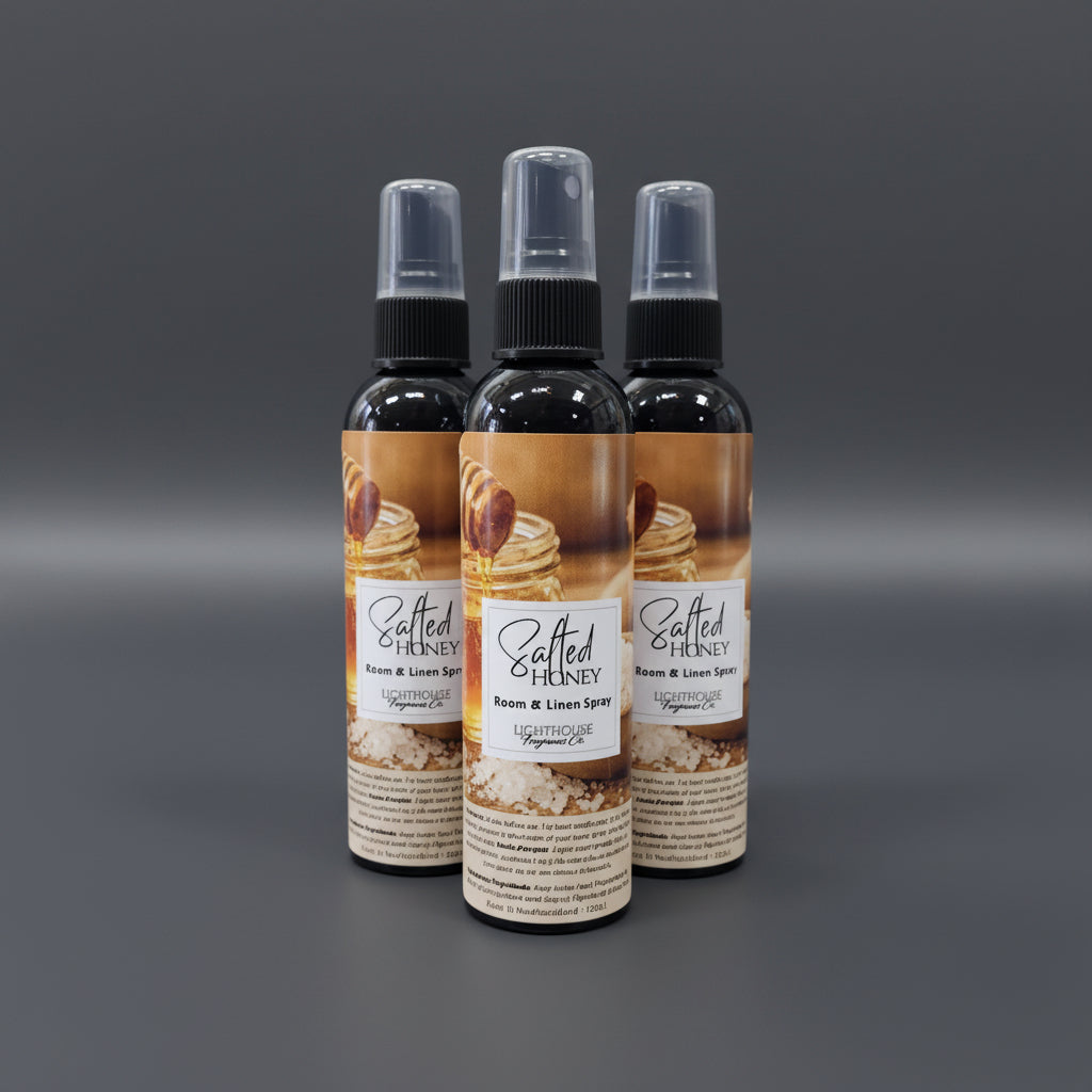 room spray bottles on a dark grey background