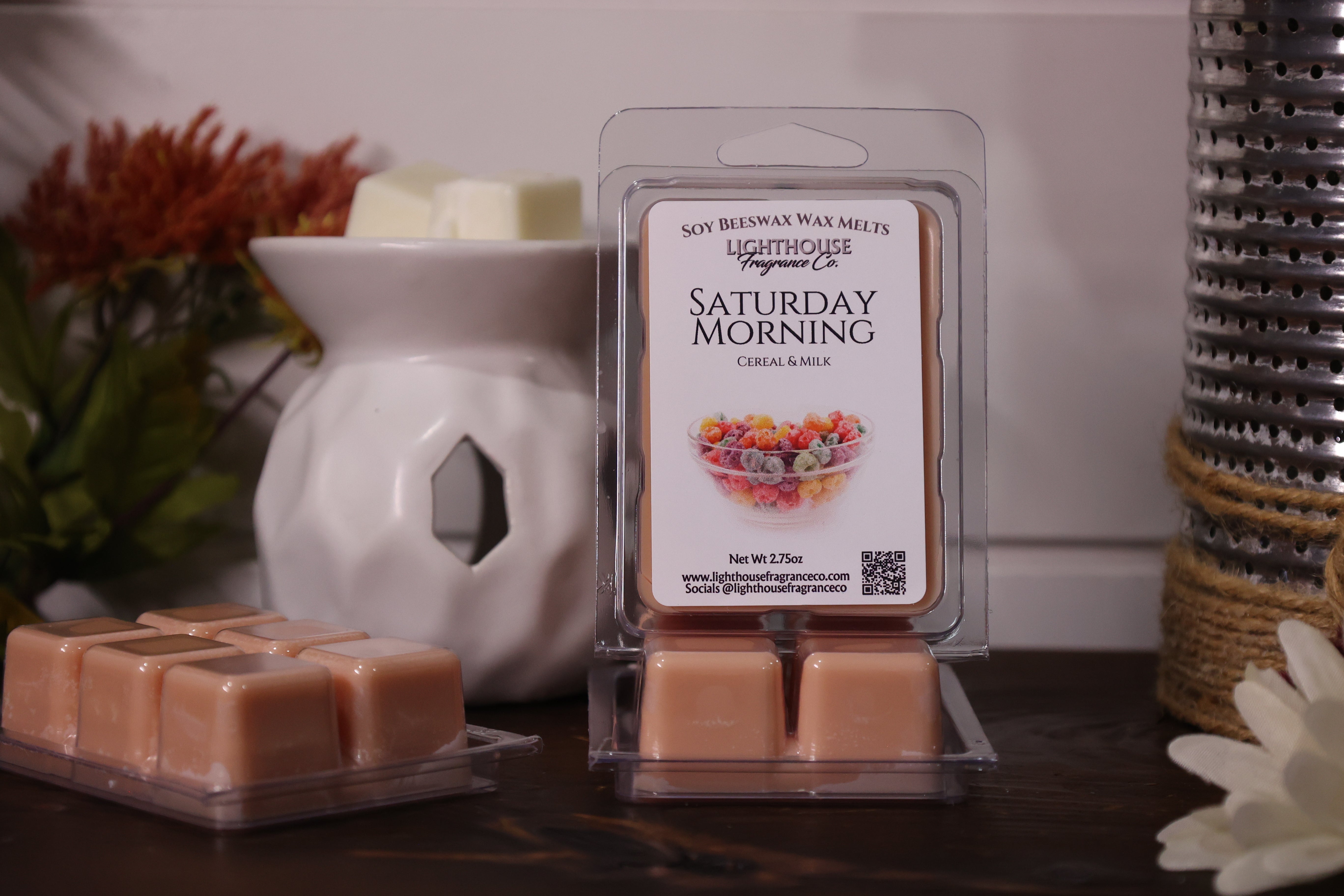Soy Blend Wax Melts packaging with 'Saturday Morning' label and wax melts in front of a white wax warmer.