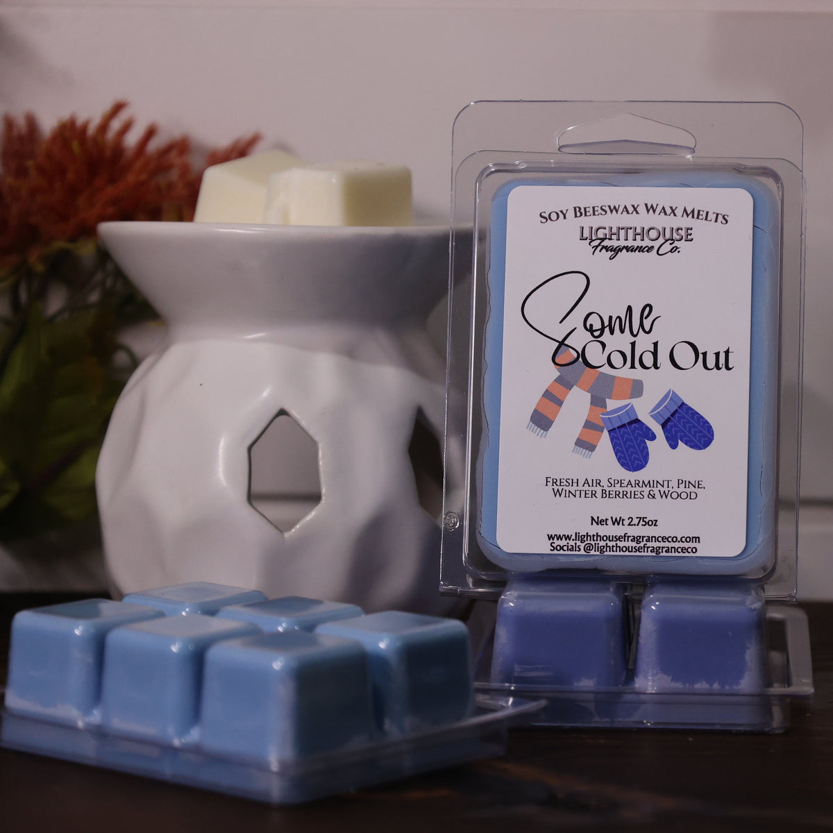 Soy wax melts packaging with a wax melter on a wooden surface.