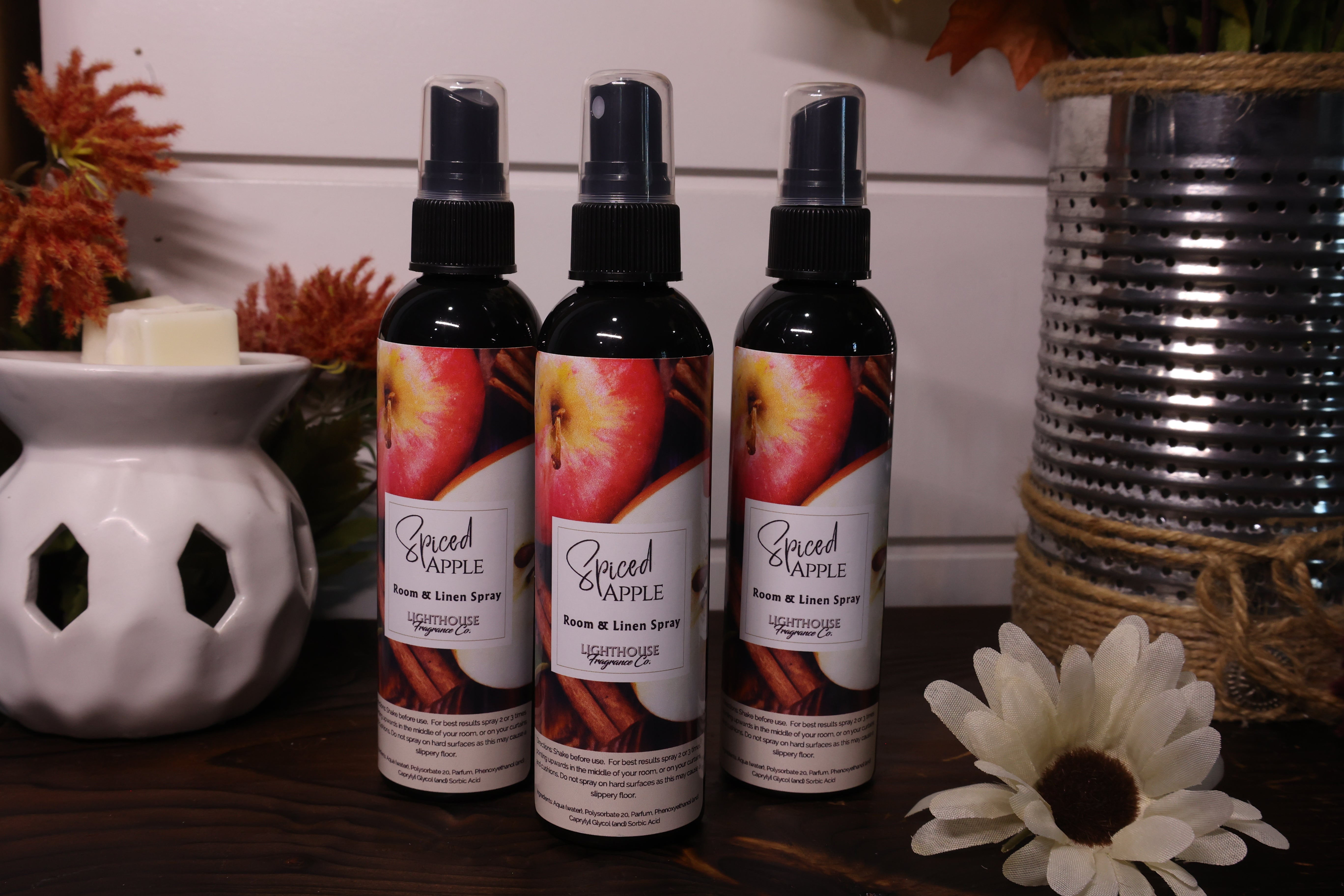 room spray bottles on wooden table