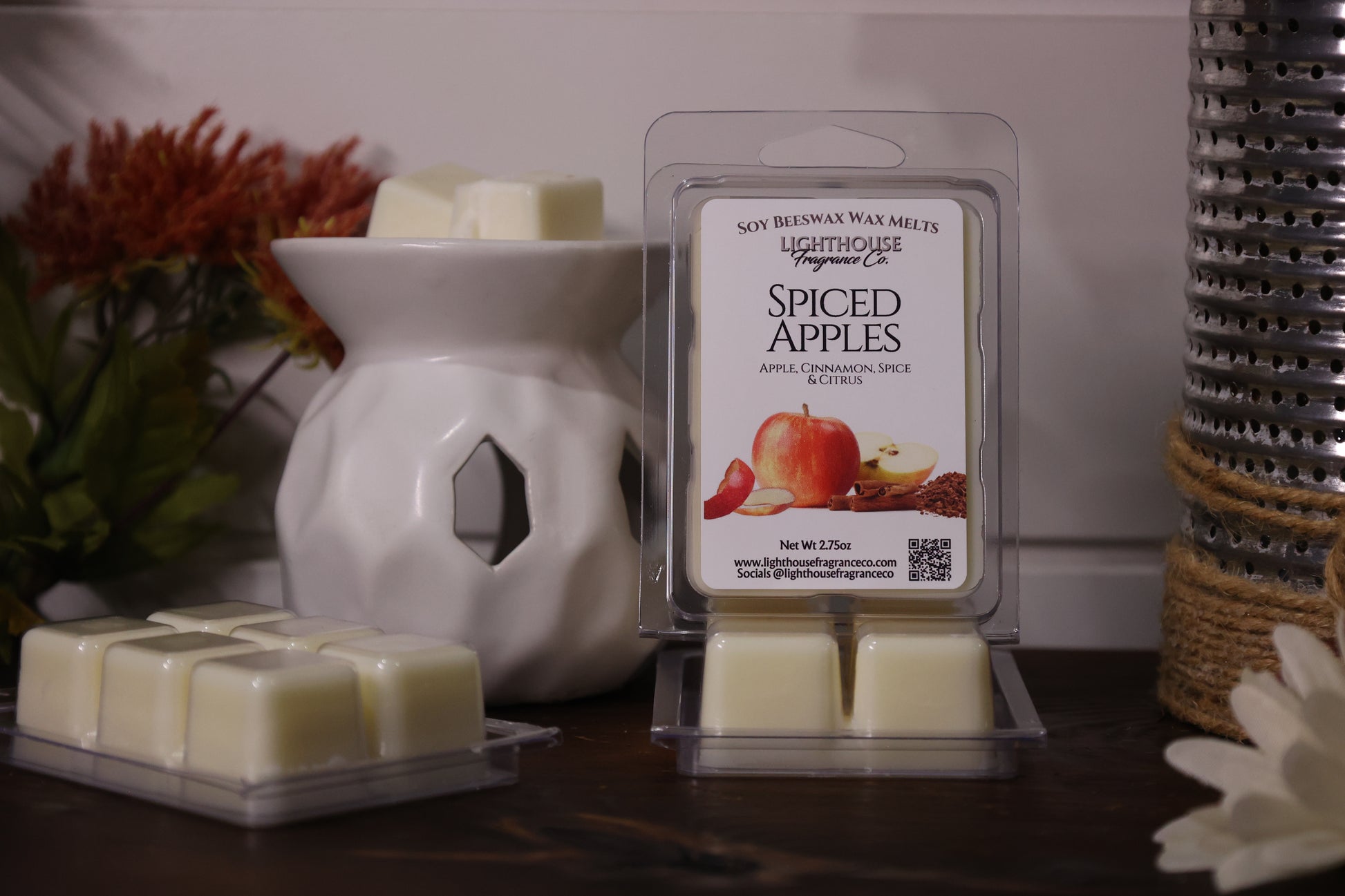 Spiced Apples wax melts packaging with a white wax warmer on a wooden surface.
