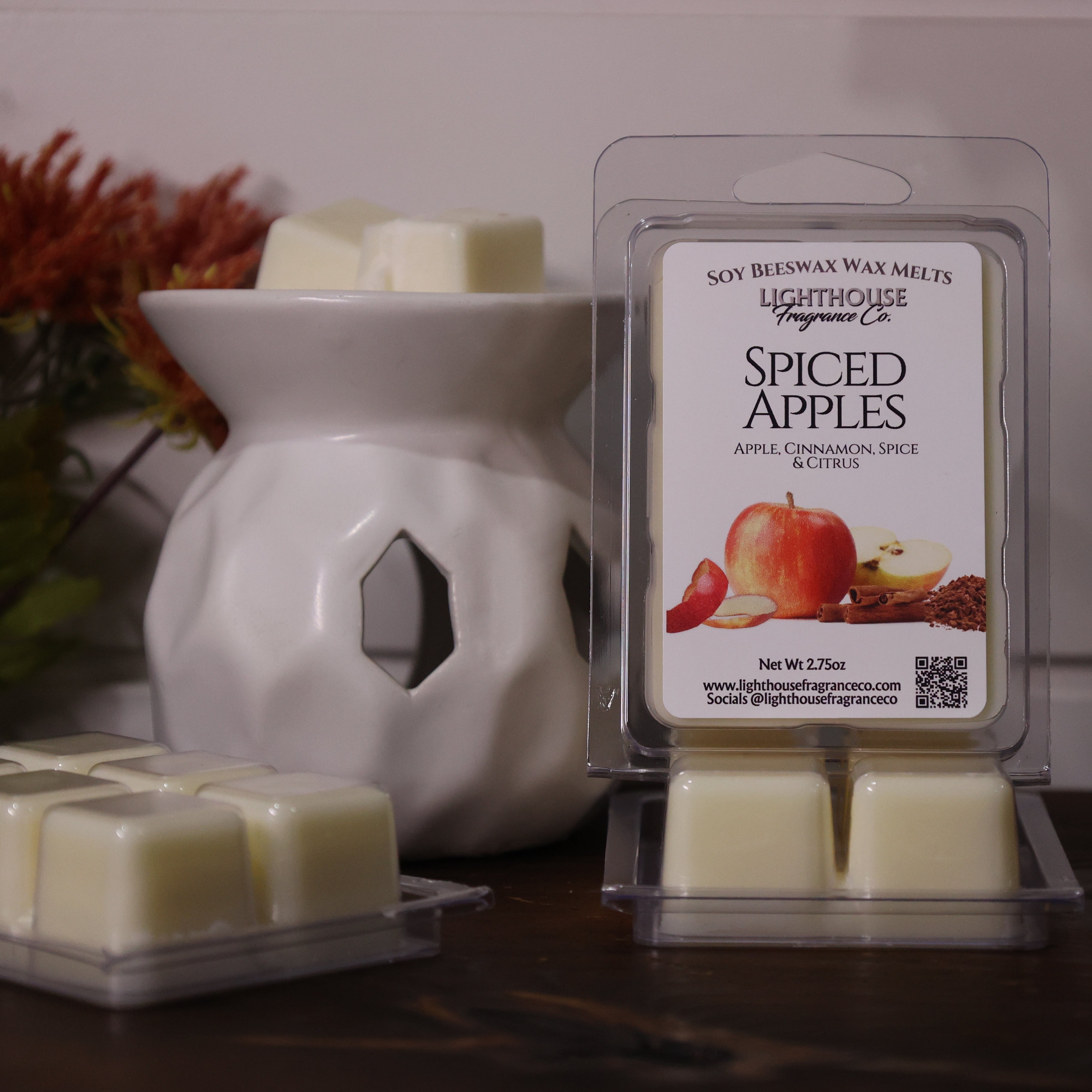 Spiced Apples wax melts packaging with a white wax warmer on a wooden surface.