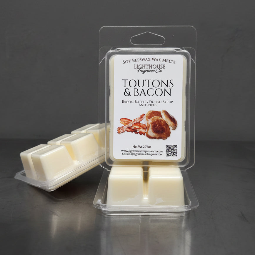 Packaged soap with 'Toutons & Bacon' a Newfoundland collection scent - on a gray surface