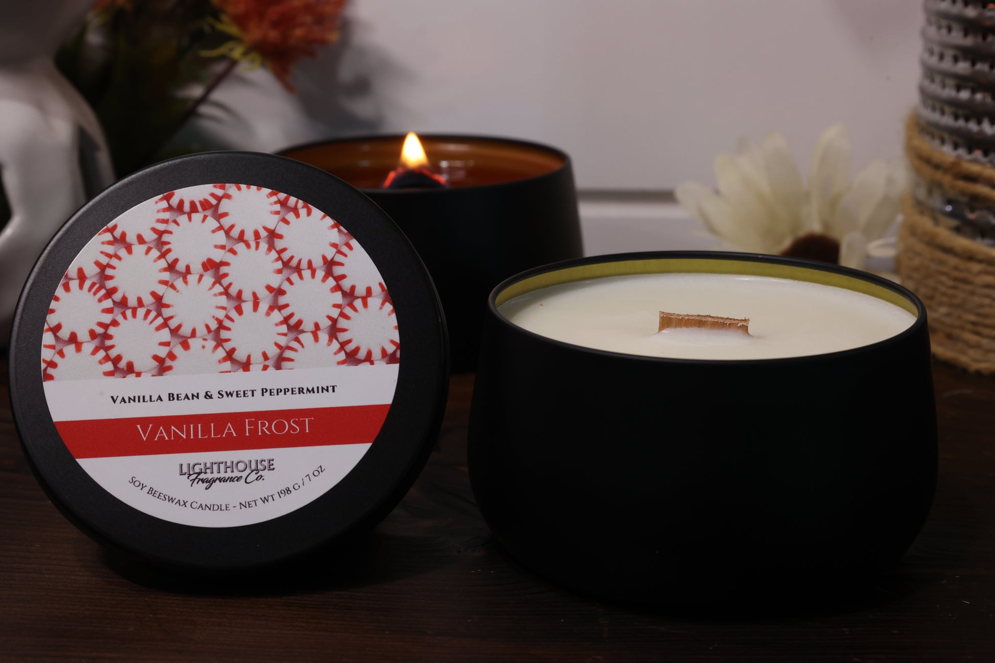 Vanilla Frost candle with decorative label on a wooden surface