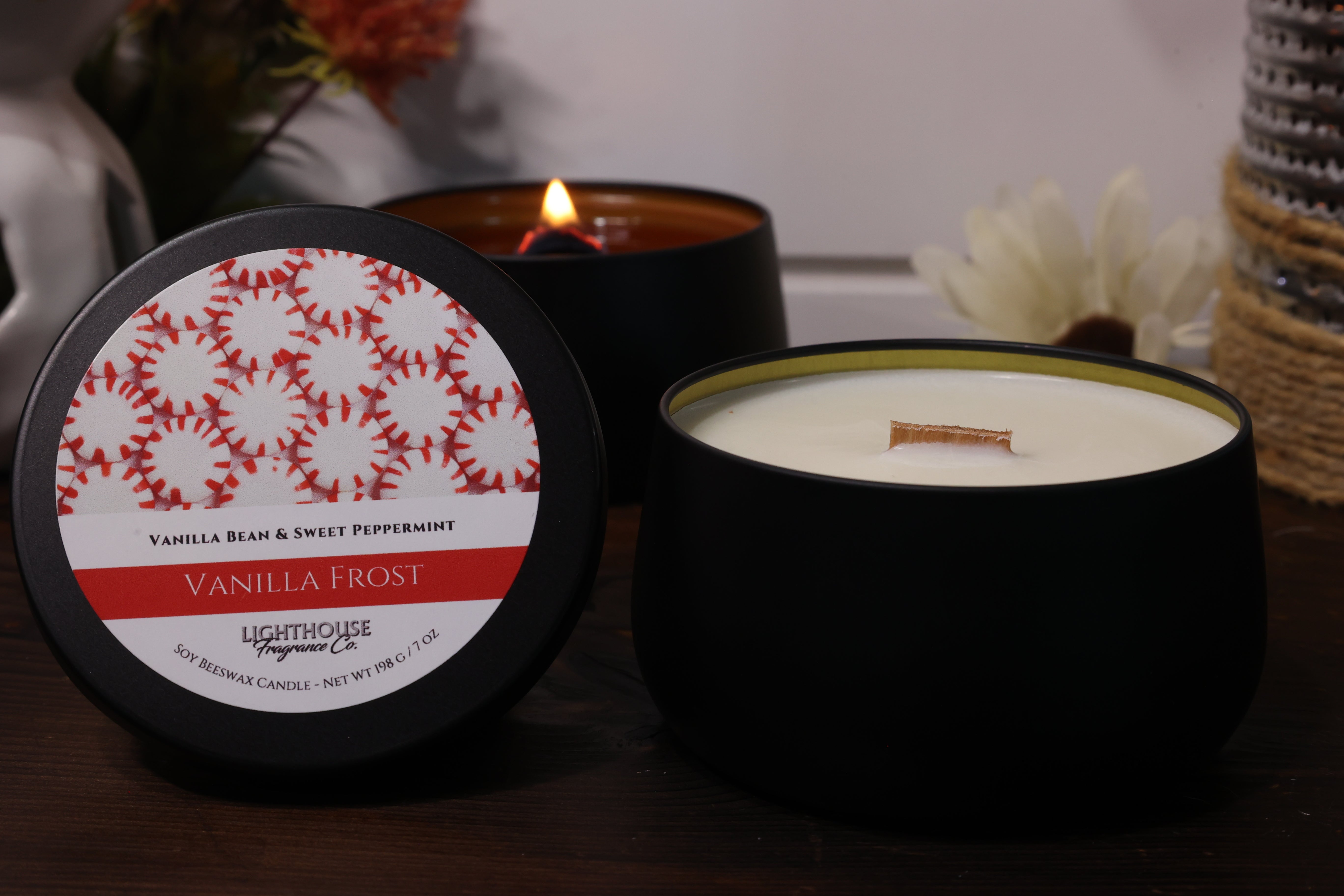 Vanilla Frost candle with decorative label on a wooden surface