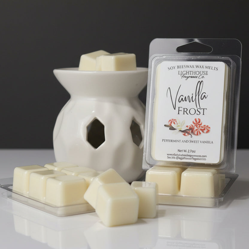 Packaged vanilla wax melt with a wax warmer and additional melts on a wooden surface.