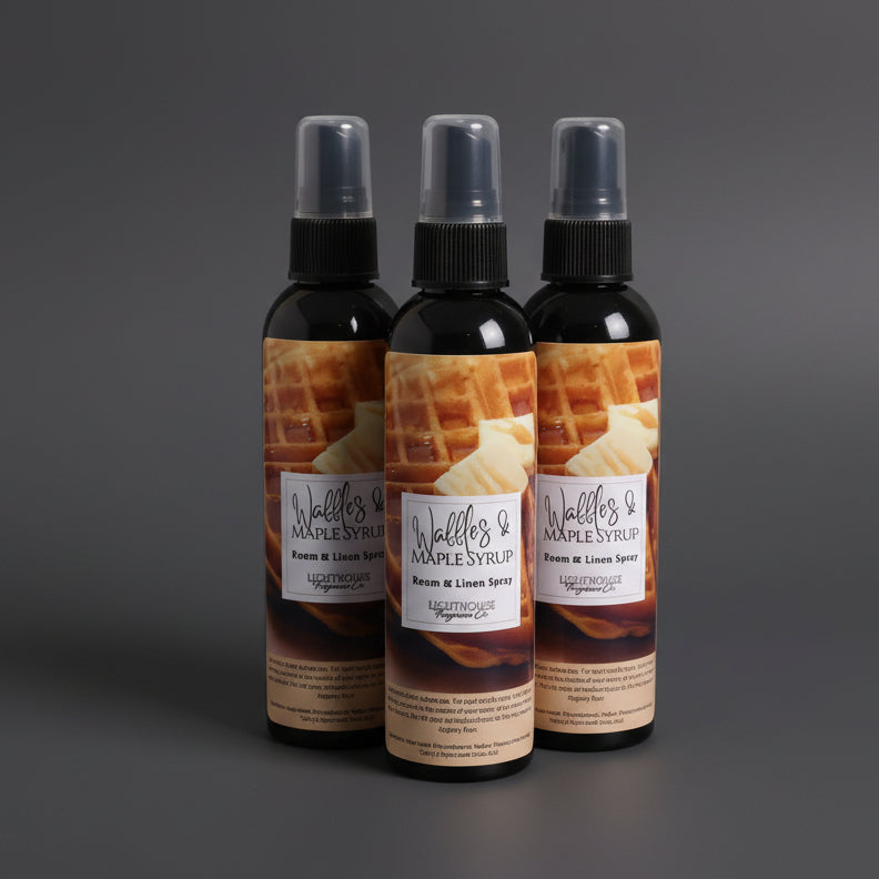 room spray bottles on wooden table