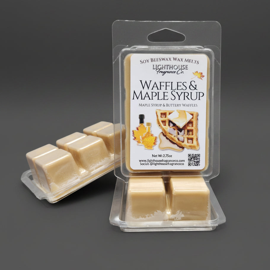 Waffles & Maple Syrup wax melts packaging on a gray surface.  Label depicts waffles with butter and syrup, 2 small bottles of maple syrup and a maple leaf.  Made of Soy and Canadian Beeswax